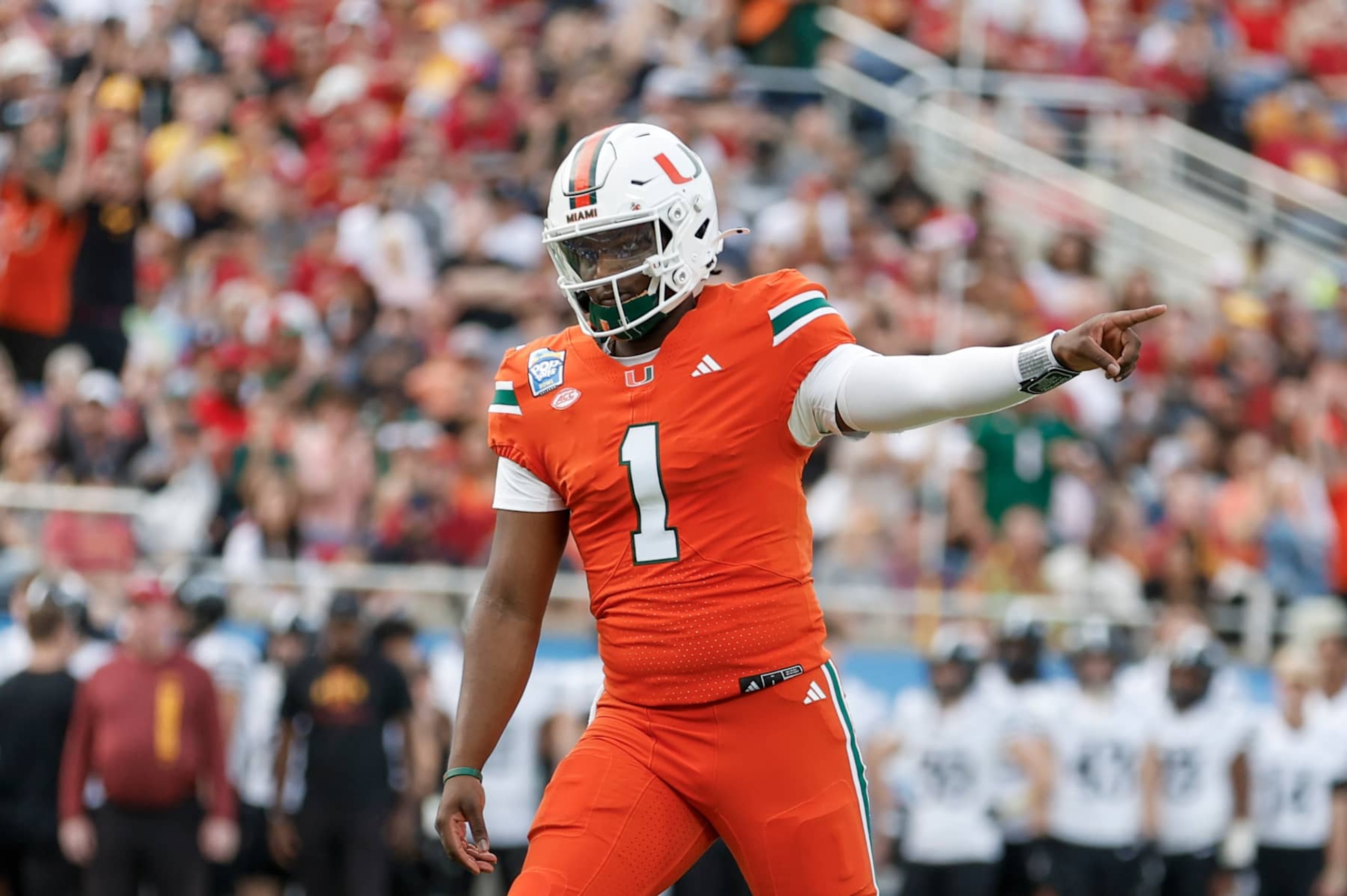 ORLANDO, FL - DECEMBER 28: Miami Hurricanes quarterback Cam Ward (1) reacts after throwing a touchdown pass during the game between the Miami Hurricanes and the Iowa State Cyclones on December 28, 2024 at Camping World Stadium in Orlando, Fl. (Photo by David Rosenblum/Icon Sportswire via Getty Images)