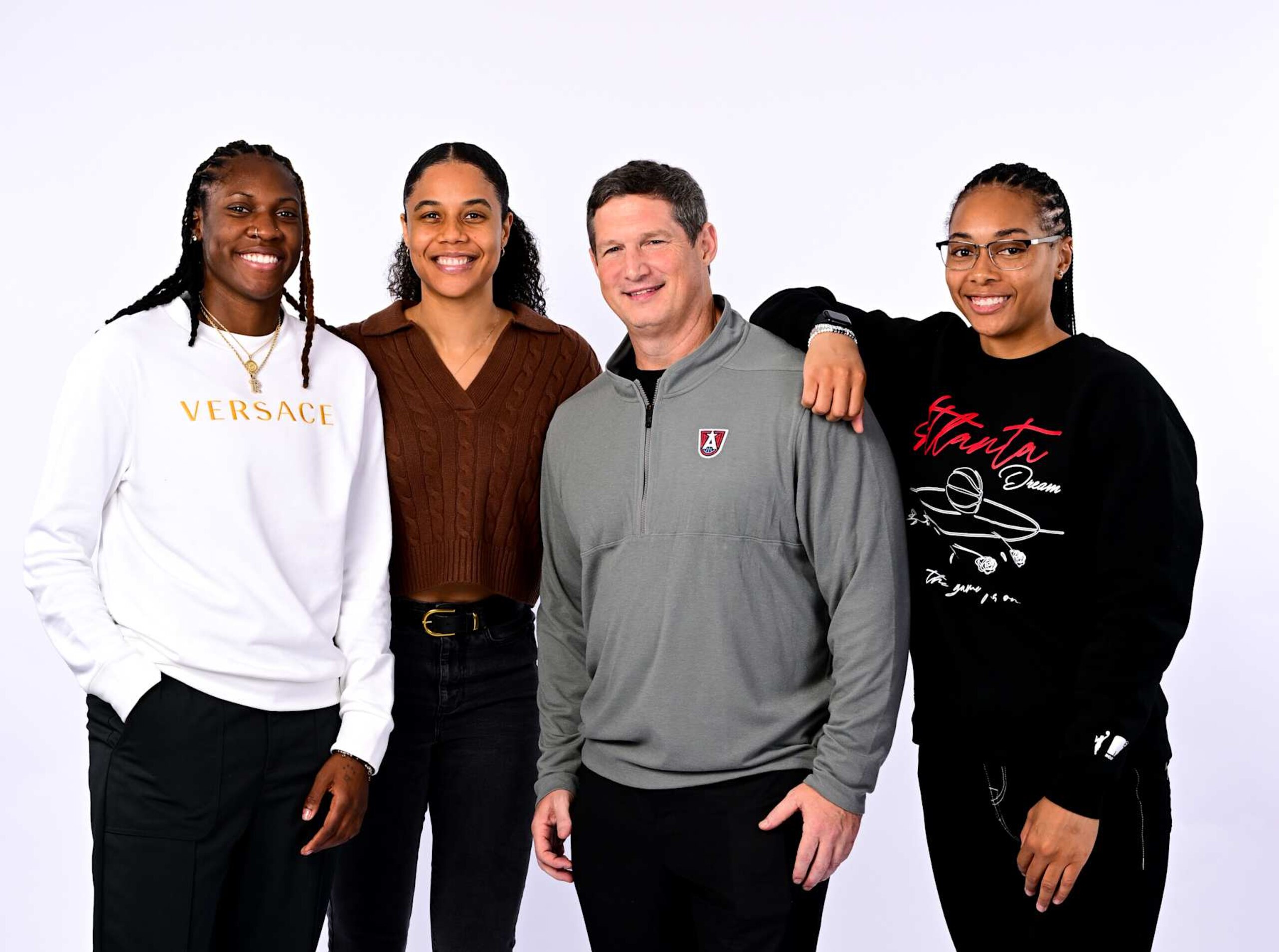 ATLANTA, GA - NOVEMBER 19: Rhyne Howard, Nia Coffey, Karl Smesko, and Allisha Gray of the Atlanta Dream poses for a portrait during a introductory press conference at Signia Hotel on November 19th, 2024 in Atlanta, Georgia. NOTE TO USER: User expressly acknowledges and agrees that, by downloading and or using this Photograph, user is consenting to the terms and conditions of the Getty Images License Agreement. Mandatory Copyright Notice: Copyright 2024 NBAE (Photo by Adam Hagy/NBAE via Getty Images)