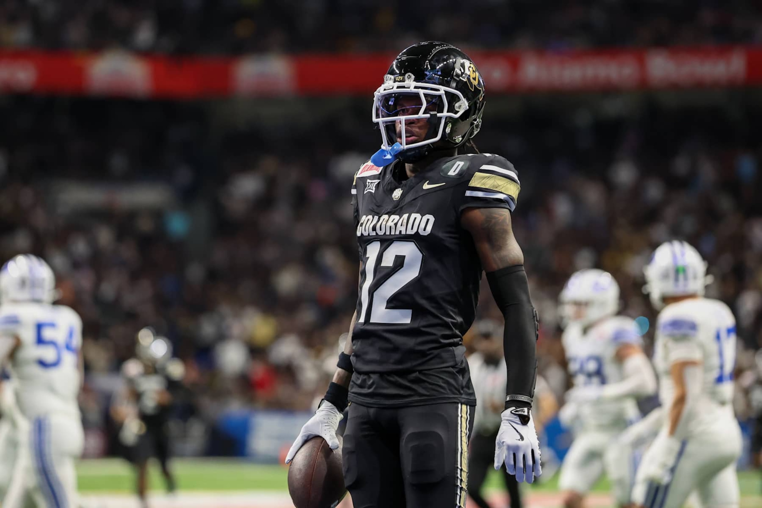 SAN ANTONIO, TX - DECEMBER 28: Colorado Buffaloes wide receiver Travis Hunter (12) celebrates a long reception during the football game between BYU Cougars and Colorado Buffalos on December 28, 2024, at the Alamodome in San Antonio, Texas. (Photo by David Buono/Icon Sportswire via Getty Images)