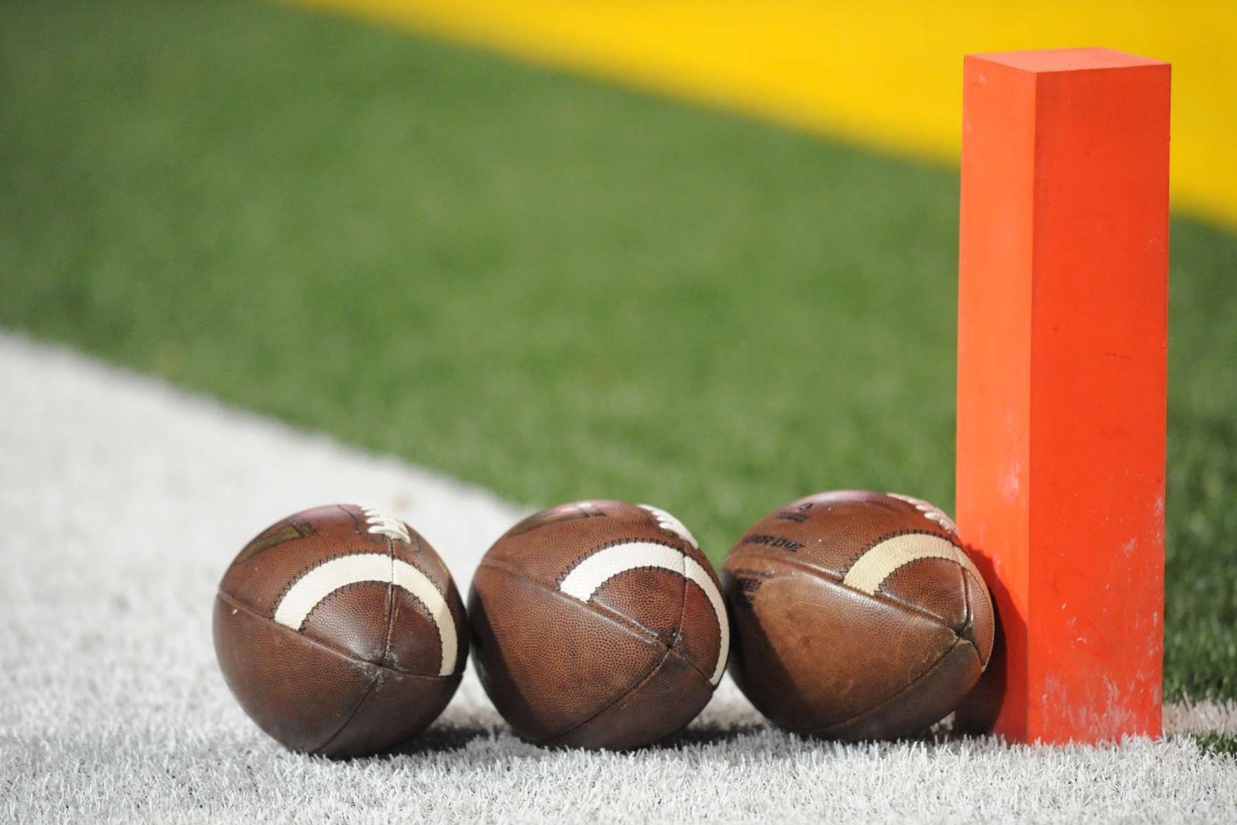 COLLEGE PARK, MD - NOVEMBER 15:  Footballs sit lined up on the field before a college football game between the Michigan State Spartans and the Maryland Terrapins at Byrd Stadium on November 15, 2014 in College Park, Maryland.  (Photo by Mitchell Layton/Getty Images)