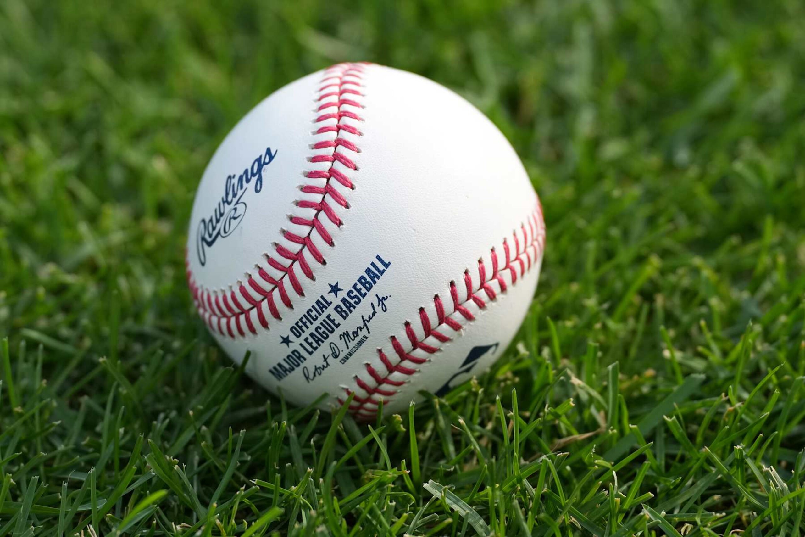 CINCINNATI, OHIO - SEPTEMBER 20: Rawlings baseball laying on the grass during batting practice before the game between the Cincinnati Reds and the Pittsburgh Pirates at Great American Ball Park on September 20, 2024 in Cincinnati, Ohio. (Photo by Jason Mowry/Getty Images)
