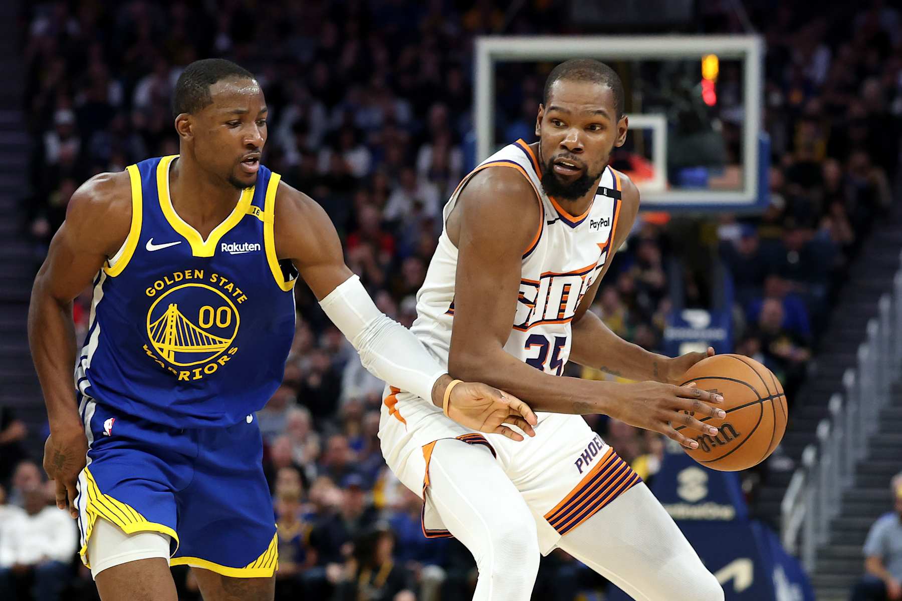 SAN FRANCISCO, CALIFORNIA - DECEMBER 28: Kevin Durant #35 of the Phoenix Suns is guarded by Jonathan Kuminga #00 of the Golden State Warriors at Chase Center on December 28, 2024 in San Francisco, California. NOTE TO USER: User expressly acknowledges and agrees that, by downloading and/or using this photograph, user is consenting to the terms and conditions of the Getty Images License Agreement.   (Photo by Ezra Shaw/Getty Images)