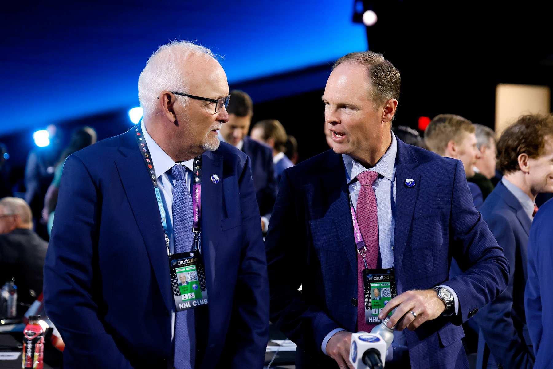 Buffalo Sabres general manager Kevyn Adams (right) confers with head coach Lindy Ruff at the 2024 NHL Draft. 