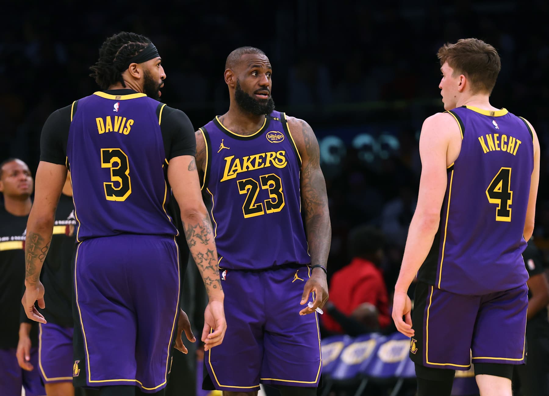 LOS ANGELES, CALIFORNIA - NOVEMBER 19: Anthony Davis #3 and LeBron James #23 of the Los Angeles Lakers react to Dalton Knecht #4, who shot nine three pointers and scored 37 points, during a 124-118 win over the Utah Jazz at Crypto.com Arena on November 19, 2024 in Los Angeles, California. (Photo by Harry How/Getty Images) NOTE TO USER: User expressly acknowledges and agrees that, by downloading and or using this photograph, User is consenting to the terms and conditions of the Getty Images License Agreement.  (Photo by Harry How/Getty Images)