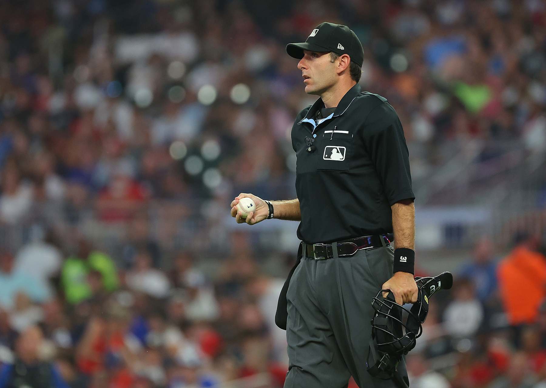 ATLANTA, GEORGIA - JULY 18:  Homeplate umpire Pat Hoberg #31 pauses the game in the sixth inning between the Atlanta Braves and the Arizona Diamondbacks at Truist Park on July 18, 2023 in Atlanta, Georgia. (Photo by Kevin C. Cox/Getty Images)