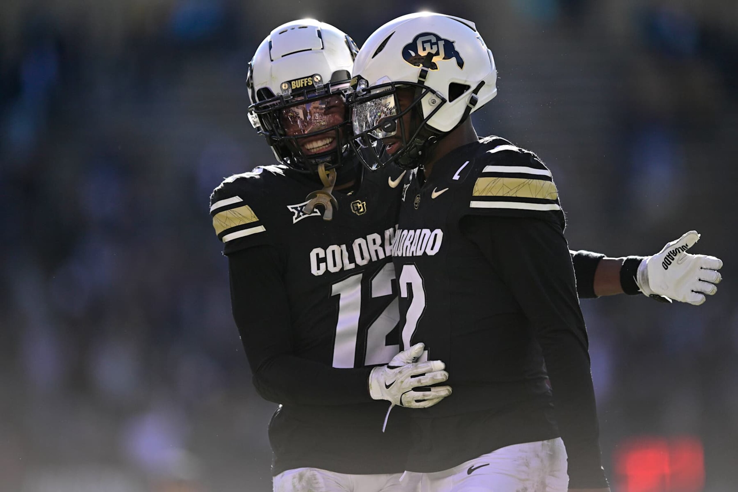 BOULDER, CO - NOVEMBER 29: Shedeur Sanders #2 and Travis Hunter #12 of the Colorado Buffaloes celebrate after a third quarter touchdown against the Oklahoma State Cowboys at Folsom Field on November 29, 2024 in Boulder, Colorado. (Photo by Dustin Bradford/Getty Images) BOULDER, CO - NOVEMBER 29: Shedeur Sanders #2 and Travis Hunter #12 of the Colorado Buffaloes celebrate after a third quarter touchdown against the Oklahoma State Cowboys at Folsom Field on November 29, 2024 in Boulder, Colorado. (Photo by Dustin Bradford/Getty Images)