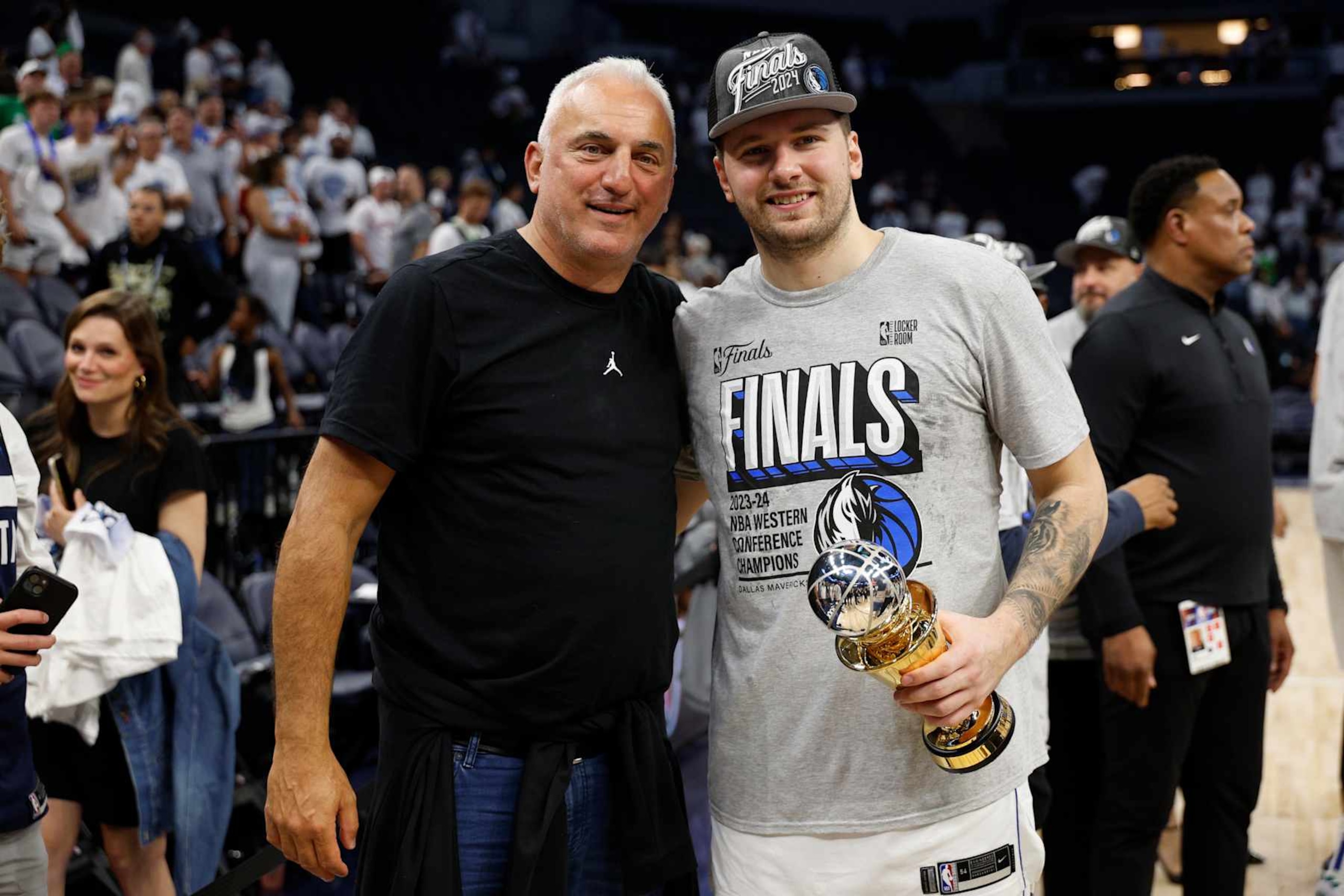 MINNEAPOLIS, MINNESOTA - MAY 30: Luka Doncic #77 of the Dallas Mavericks celebrates with is father Sasa after a 124-103 victory against the Minnesota Timberwolves in Game Five of the Western Conference Finals at Target Center on May 30, 2024 in Minneapolis, Minnesota. NOTE TO USER: User expressly acknowledges and agrees that, by downloading and or using this photograph, User is consenting to the terms and conditions of the Getty Images License Agreement. (Photo by David Berding/Getty Images)