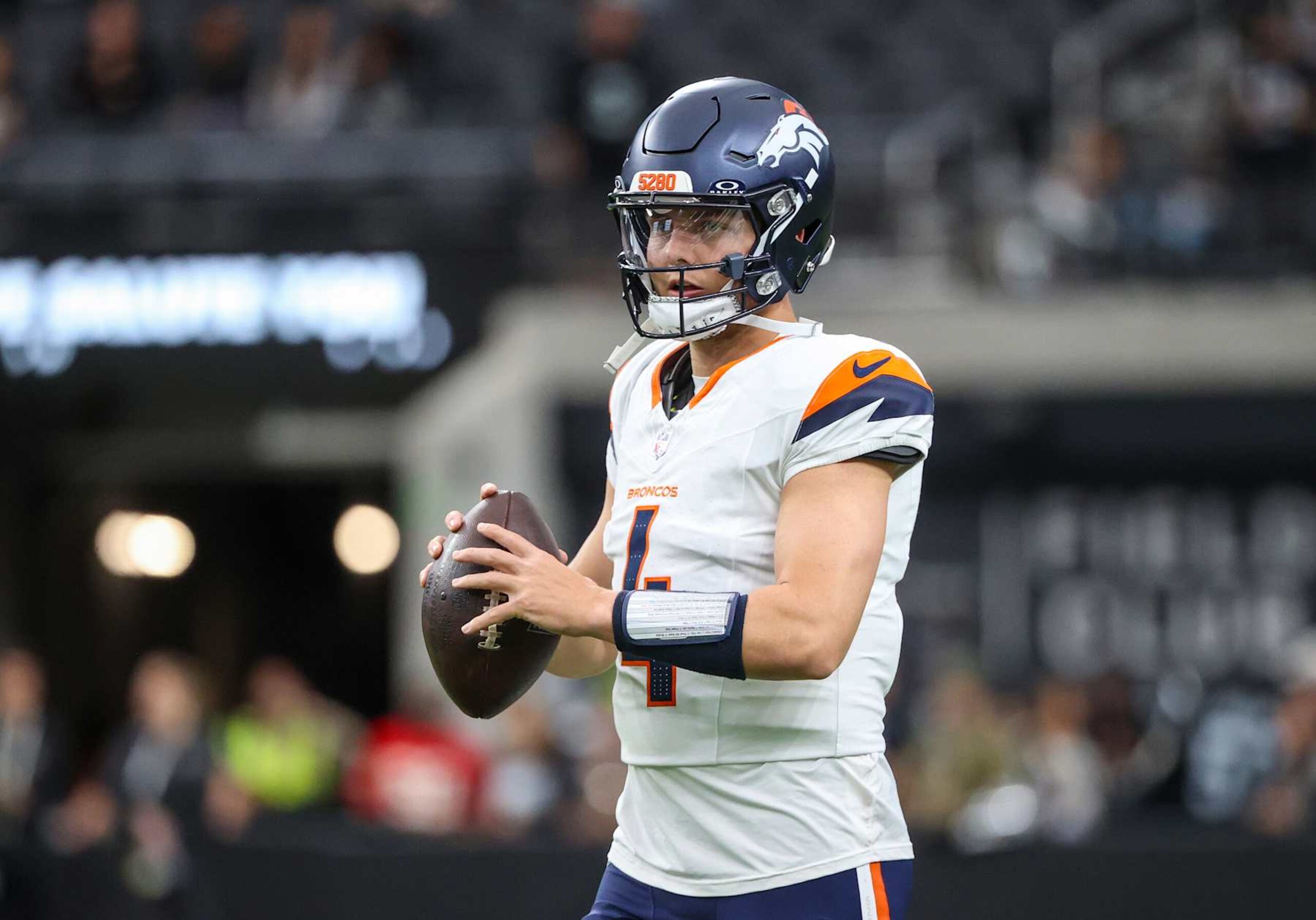 LAS VEGAS, NEVADA - NOVEMBER 24: Quarterback Zach Wilson #4 of the Denver Broncos warms up prior to a game against the Las Vegas Raiders at Allegiant Stadium on November 24, 2024 in Las Vegas, Nevada. (Photo by Ian Maule/Getty Images)