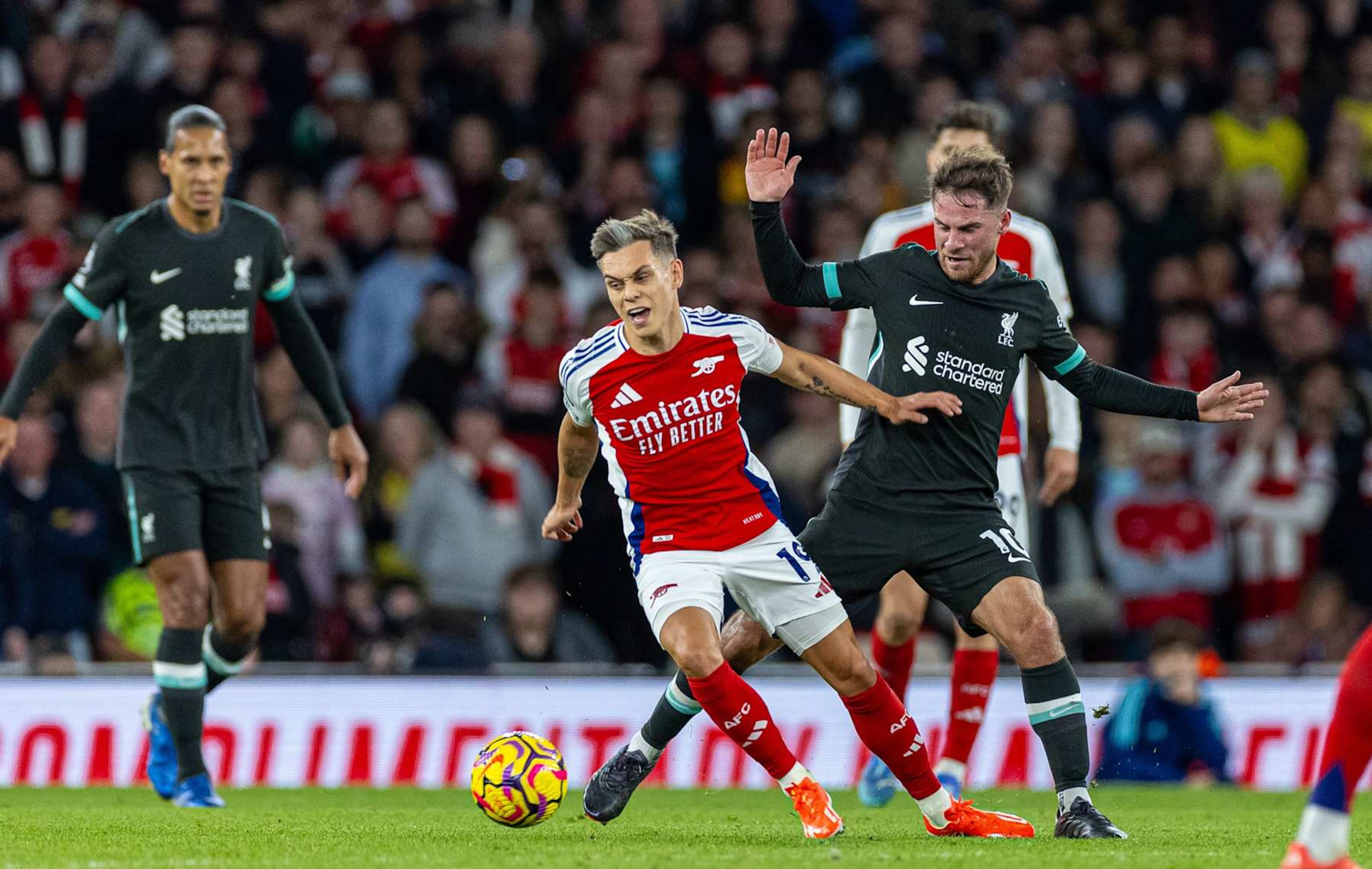 Arsenal's Leandro Trossard 2nd L is challenged by Liverpool's Alexis Mac Allister during the English Premier League football match between Arsenal and Liverpool in London, Britain, on Oct. 27, 2024. Xinhua FOR EDITORIAL USE ONLY. NOT FOR SALE FOR MARKETING OR ADVERTISING CAMPAIGNS. NO USE WITH UNAUTHORIZED AUDIO, VIDEO, DATA, FIXTURE LISTS, CLUB/LEAGUE LOGOS OR "LIVE" SERVICES. ONLINE IN-MATCH USE LIMITED TO 45 IMAGES, NO VIDEO EMULATION. NO USE IN BETTING, GAMES OR SINGLE CLUB/LEAGUE/PLAYER PUBLICATIONS. (Photo by Xinhua via Getty Images)