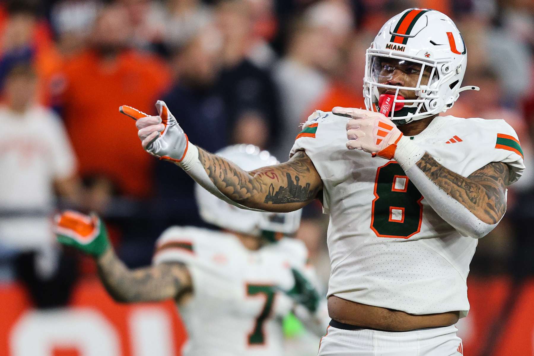 SYRACUSE, NEW YORK - NOVEMBER 30: Elijah Arroyo #8 of the Miami Hurricanes signals during the third quarter against the Syracuse Orange at JMA Wireless Dome on November 30, 2024 in Syracuse, New York. (Photo by Bryan Bennett/Getty Images)