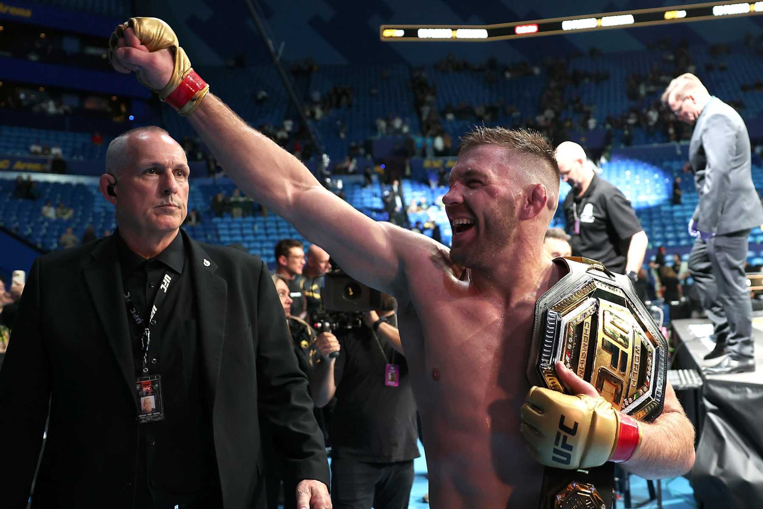Dricus Du Plessis leaves the Octagon after beating Israel Adesanya.