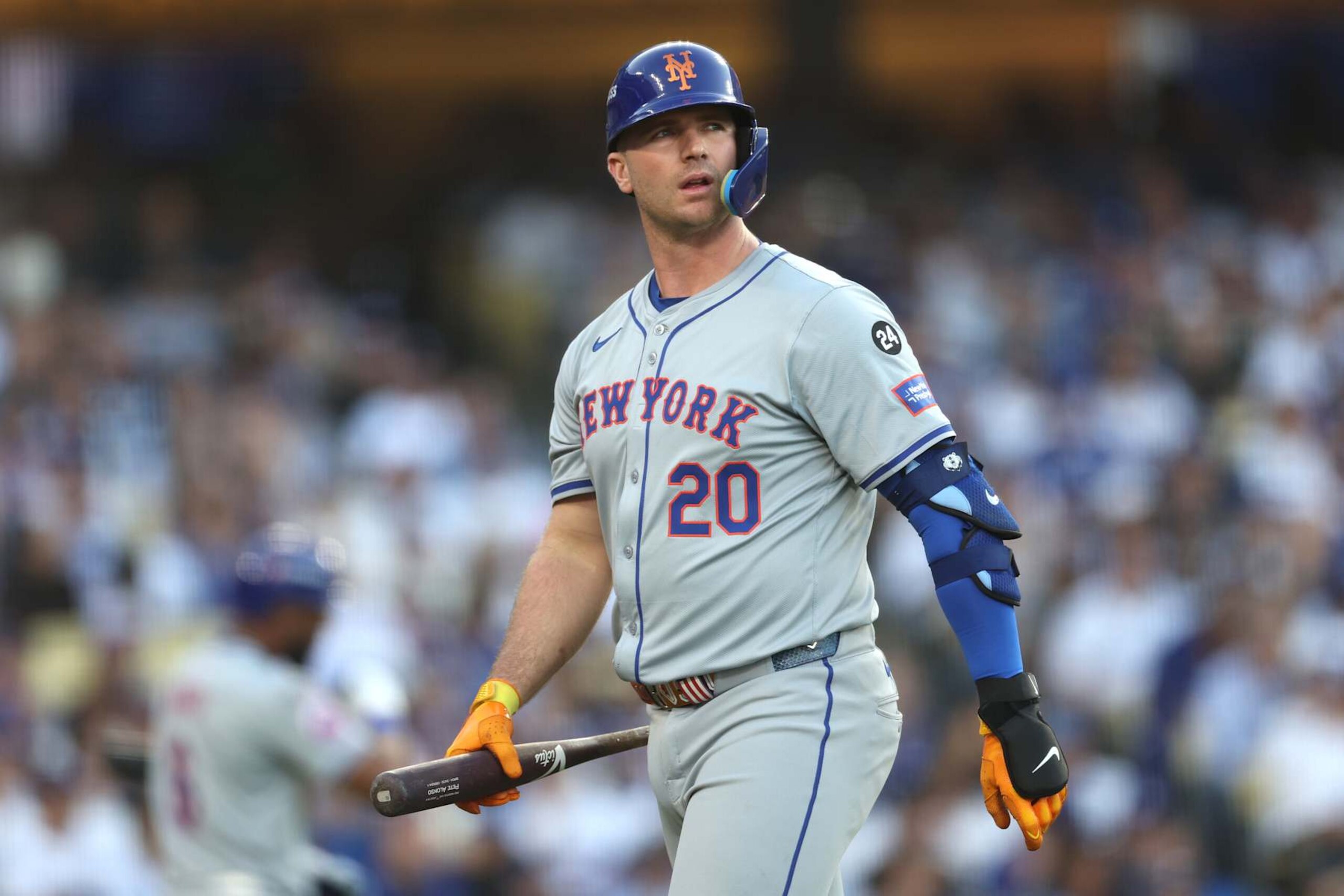 LOS ANGELES, CALIFORNIA - OCTOBER 13: Pete Alonso #20 of the New York Mets walks back to the dugout after striking out in the second inning against the Los Angeles Dodgers during Game One of the Championship Series at Dodger Stadium on October 13, 2024 in Los Angeles, California. (Photo by Harry How/Getty Images) LOS ANGELES, CALIFORNIA - OCTOBER 13: Pete Alonso #20 of the New York Mets walks back to the dugout after striking out in the second inning against the Los Angeles Dodgers during Game One of the Championship Series at Dodger Stadium on October 13, 2024 in Los Angeles, California. (Photo by Harry How/Getty Images)