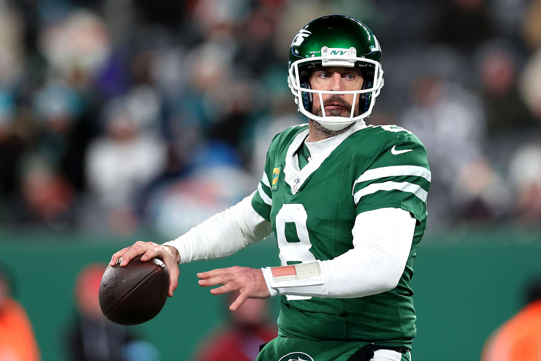 EAST RUTHERFORD, NEW JERSEY - JANUARY 05: Aaron Rodgers #8 of the New York Jets in action against the Miami Dolphins at MetLife Stadium on January 05, 2025 in East Rutherford, New Jersey. (Photo by Luke Hales/Getty Images)