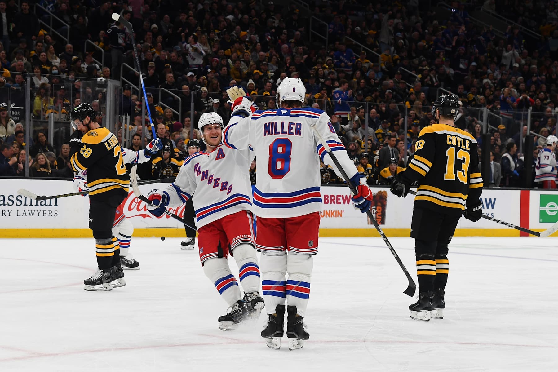 BOSTON, MASSACHUSETTS - FEBRUARY 1: Adam Fox #23 andJ.T. Miller #8 of the New York Rangers celebrate the first-period goal against the Boston Bruins on February 1, 2025, at the TD Garden in Boston, Massachusetts. (Photo by Steve Babineau/NHLI via Getty Images)