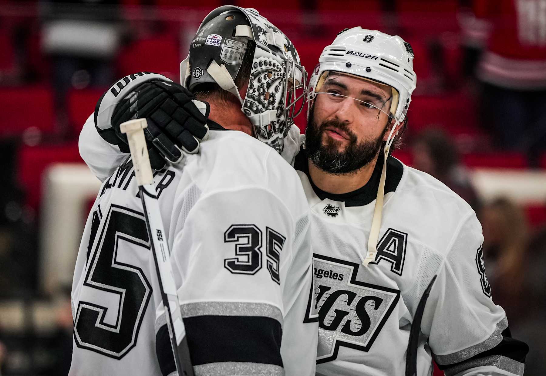 RALEIGH, NORTH CAROLINA - FEBRUARY 01:  Darcy Kuemper #35 of the Los Angeles Kings celebrates with teammates after a 4-2 victory against the Los Angeles Kings at Lenovo Center on February 01, 2025 in Raleigh, North Carolina.  (Photo by Josh Lavallee/NHLI via Getty Images)