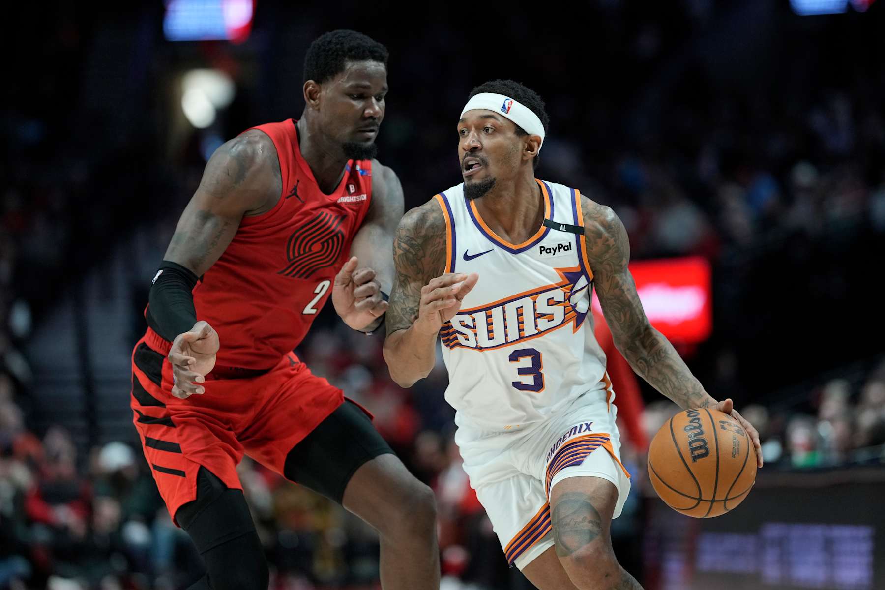 PORTLAND, OREGON - FEBRUARY 03: Bradley Beal #3 of the Phoenix Suns drives against Deandre Ayton #2 of the Portland Trail Blazers during the second half at Moda Center on February 03, 2025 in Portland, Oregon. NOTE TO USER: User expressly acknowledges and agrees that, by downloading and or using this photograph, User is consenting to the terms and conditions of the Getty Images License Agreement. (Photo by Soobum Im/Getty Images)
