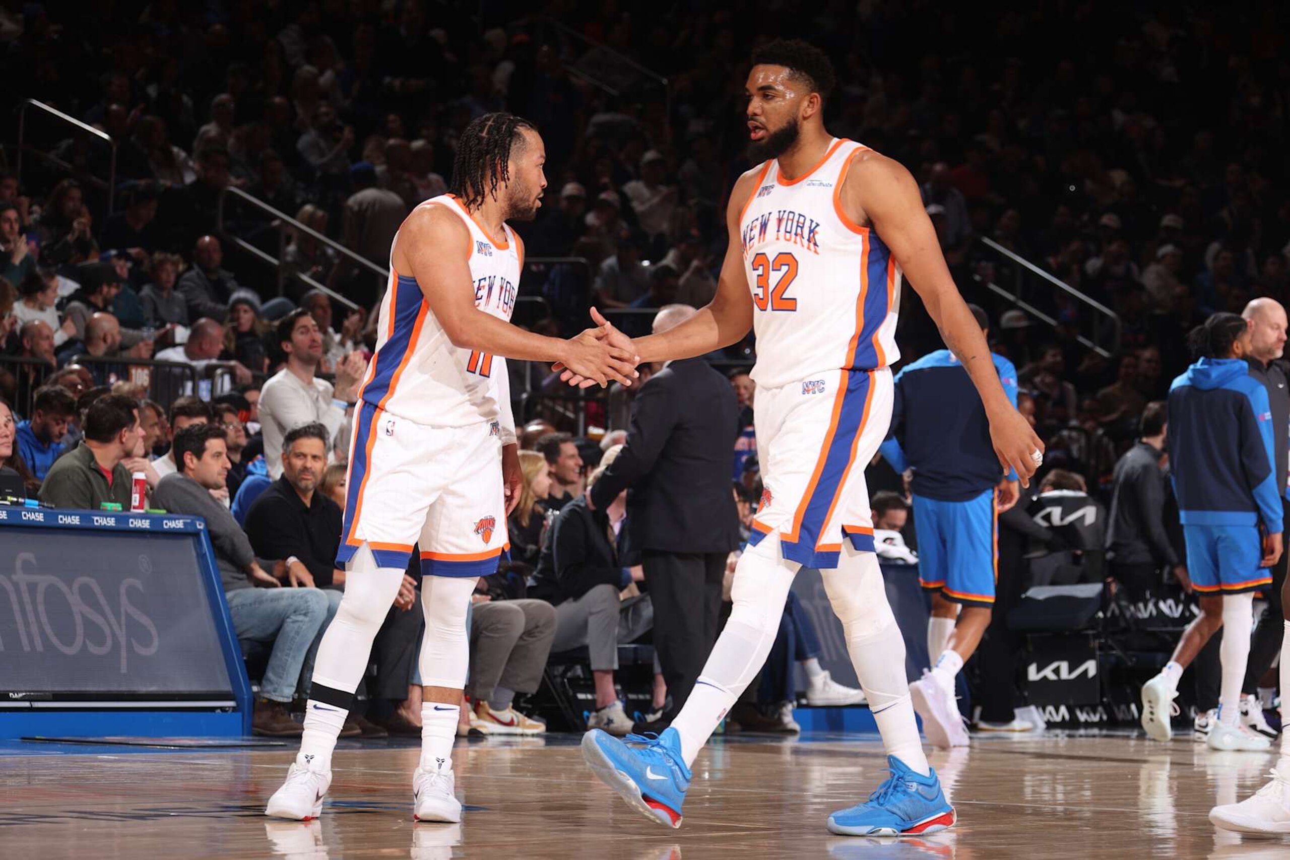 NEW YORK, NY - JANUARY 10:  Jalen Brunson #11 and Karl-Anthony Towns #32 of the New York Knicks high five during the game against the Oklahoma City Thunder  on January 10, 2025 at Madison Square Garden in New York City, New York.  NOTE TO USER: User expressly acknowledges and agrees that, by downloading and or using this photograph, User is consenting to the terms and conditions of the Getty Images License Agreement. Mandatory Copyright Notice: Copyright 2024 NBAE  (Photo by Nathaniel S. Butler/NBAE via Getty Images)