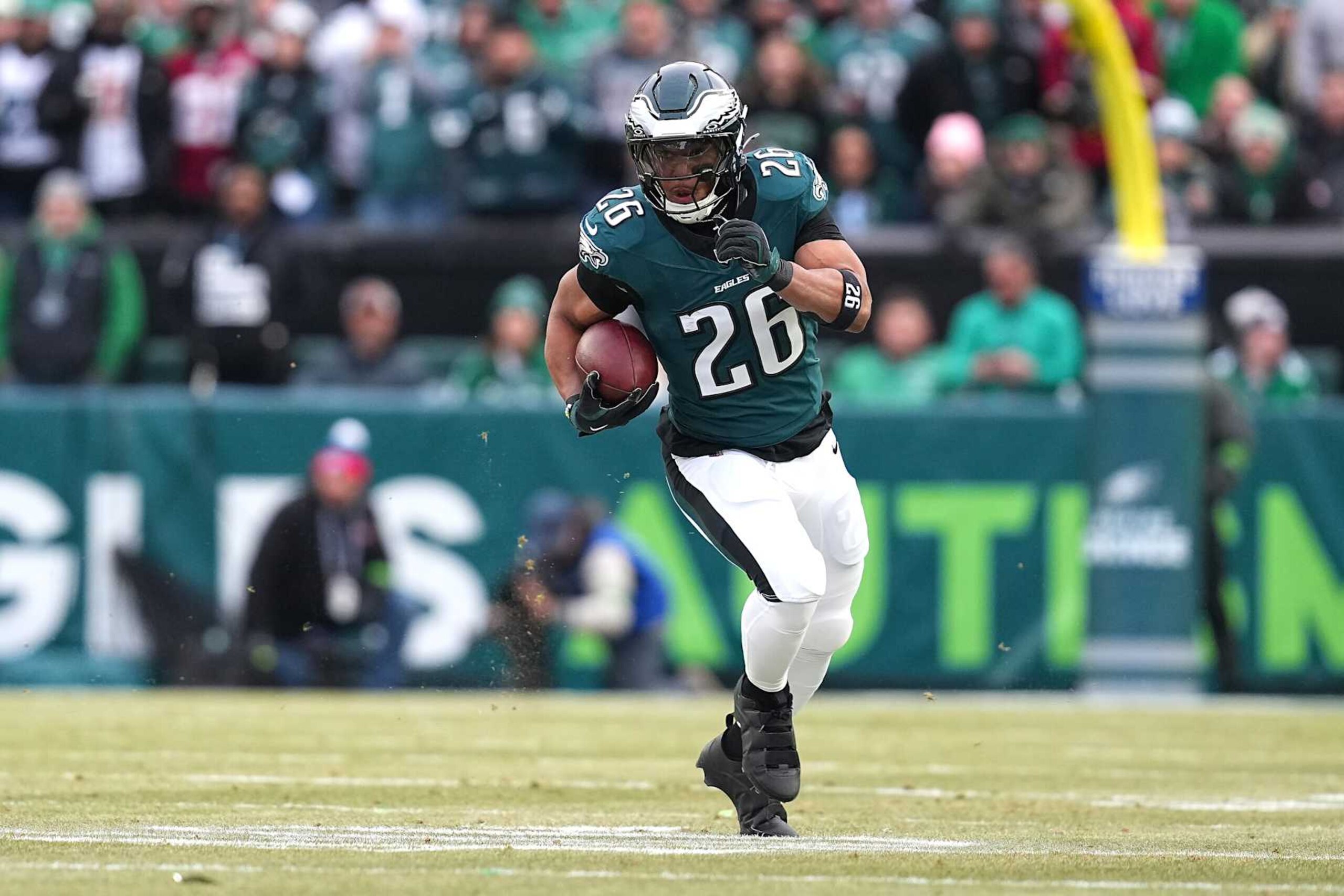 PHILADELPHIA, PENNSYLVANIA - JANUARY 26: Saquon Barkley #26 of the Philadelphia Eagles runs the ball to score a 60 yard touchdown against the Washington Commanders during the first quarter in the NFC Championship Game at Lincoln Financial Field on January 26, 2025 in Philadelphia, Pennsylvania.  (Photo by Mitchell Leff/Getty Images)