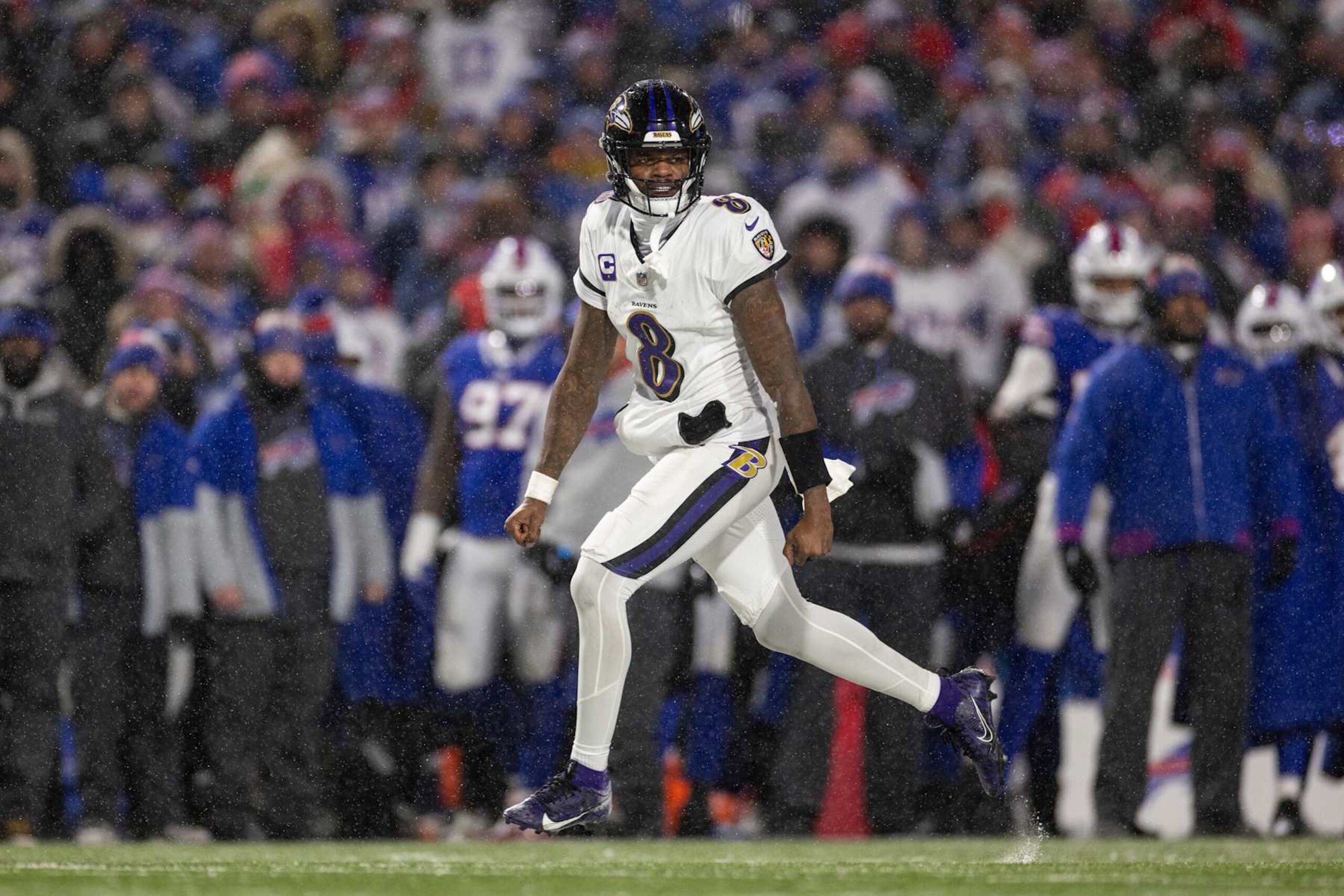 ORCHARD PARK, NEW YORK - JANUARY 19: Lamar Jackson #8 of the Baltimore Ravens celebrates after a touchdown during an NFL Football game against the Buffalo Bills at Highmark Stadium on January 19, 2025 in Orchard Park, New York. (Photo by Michael Owens/Getty Images)