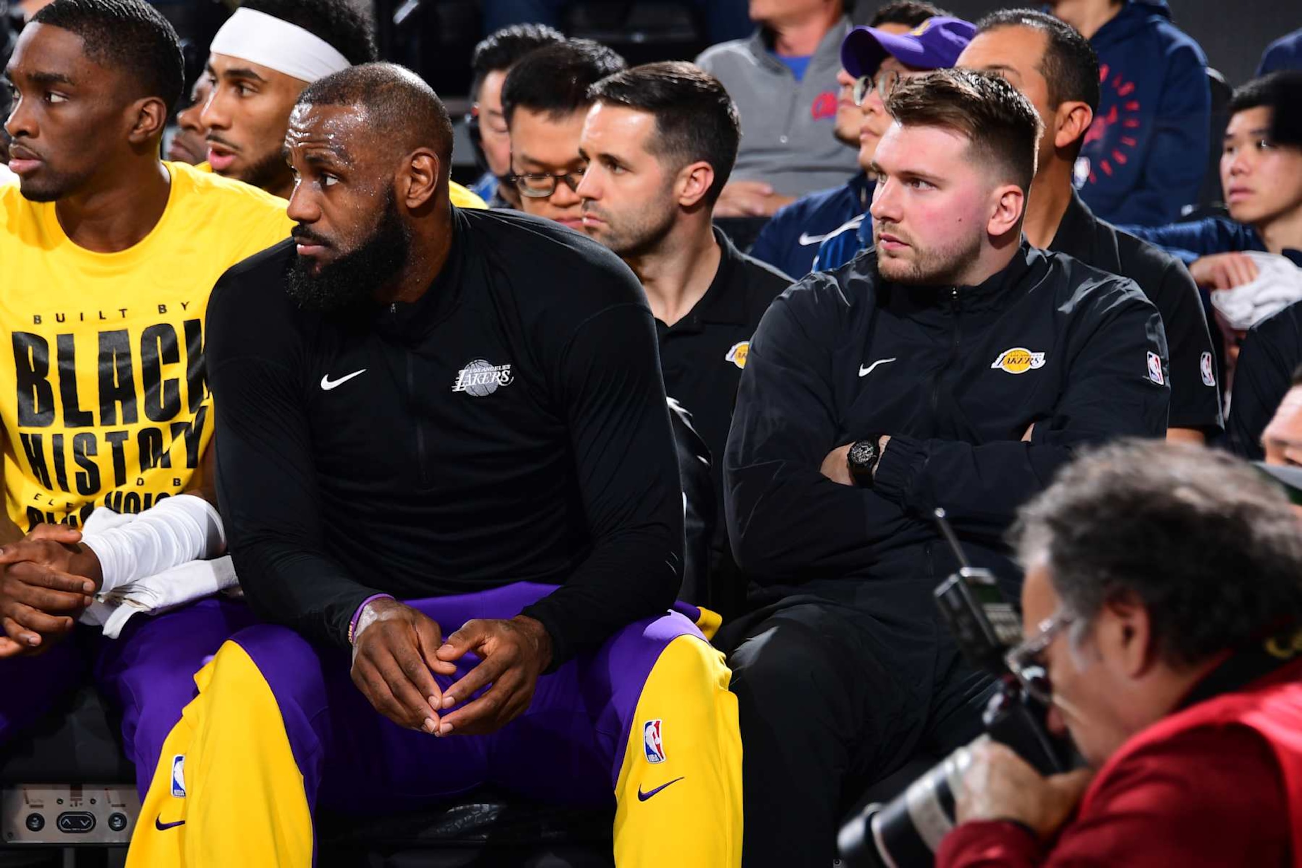 INGLEWOOD, CA - FEBRUARY 4: LeBron James #23 and Luka Doncic #77 of the Los Angeles Lakers looks on during the game against the LA Clippers on February 4, 2025 at Intuit Dome in Los Angeles, California. NOTE TO USER: User expressly acknowledges and agrees that, by downloading and/or using this Photograph, user is consenting to the terms and conditions of the Getty Images License Agreement. Mandatory Copyright Notice: Copyright 2025 NBAE (Photo by Adam Pantozzi/NBAE via Getty Images)