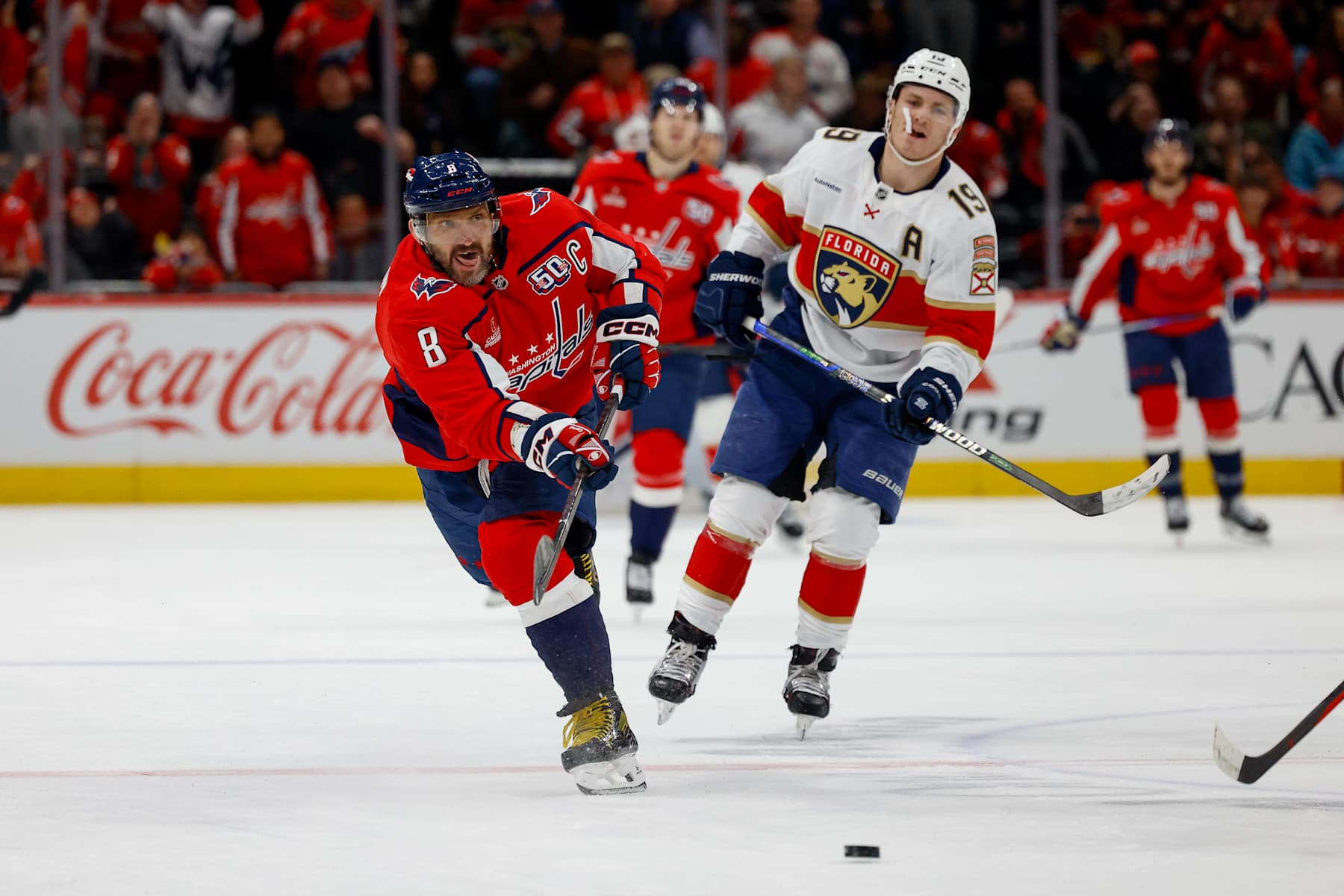 WASHINGTON, DC - FEBRUARY 4: Alex Ovechkin #8 of the Washington Capitals takes a shot for an empty net goal bringing his total goals to 878 during a game against the Florida Panthers at Capital One Arena on February 4, 2025 in Washington, D.C. (Photo by John McCreary/NHLI via Getty Images)