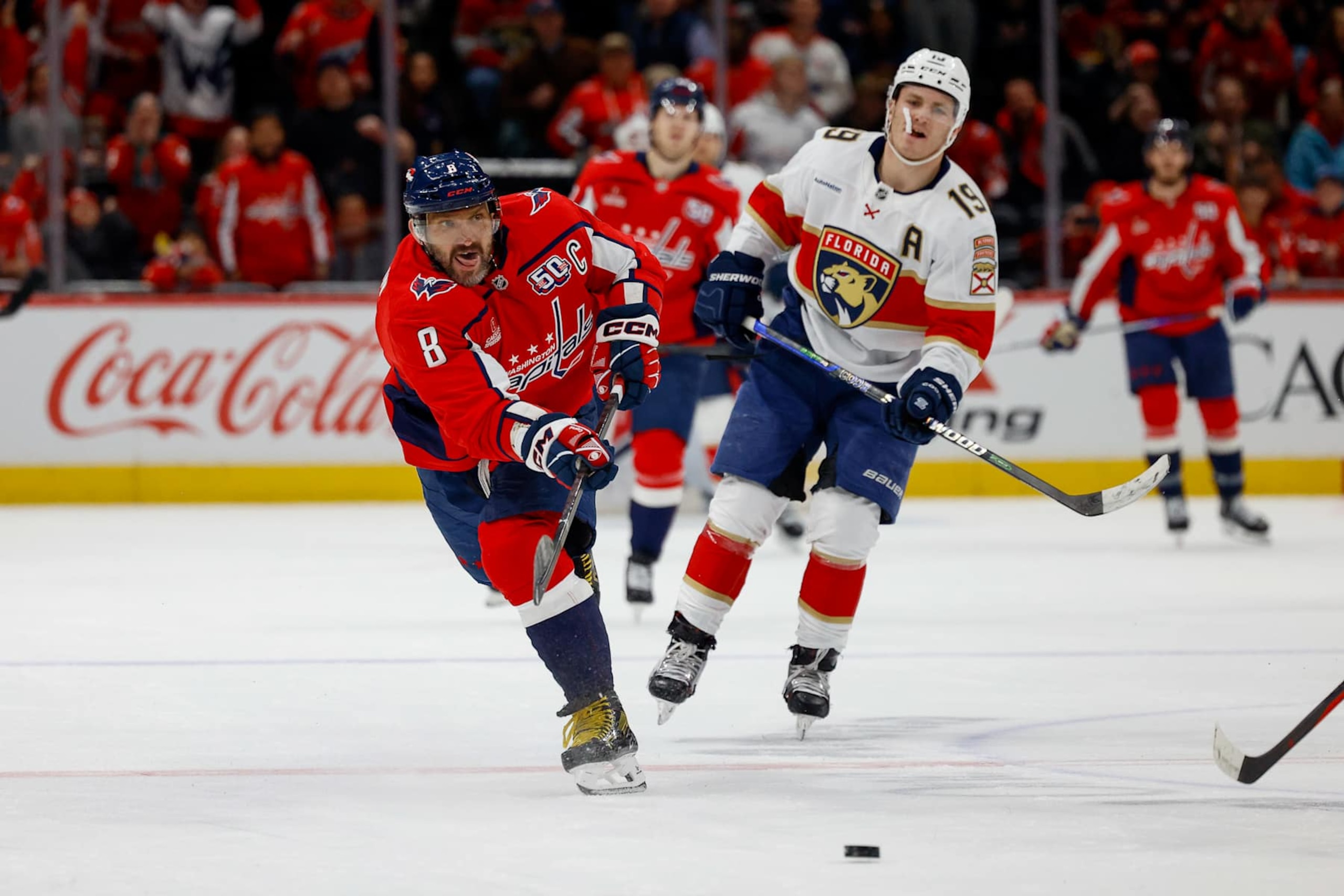WASHINGTON, DC - FEBRUARY 4: Alex Ovechkin #8 of the Washington Capitals takes a shot for an empty net goal bringing his total goals to 878 during a game against the Florida Panthers at Capital One Arena on February 4, 2025 in Washington, D.C. (Photo by John McCreary/NHLI via Getty Images)