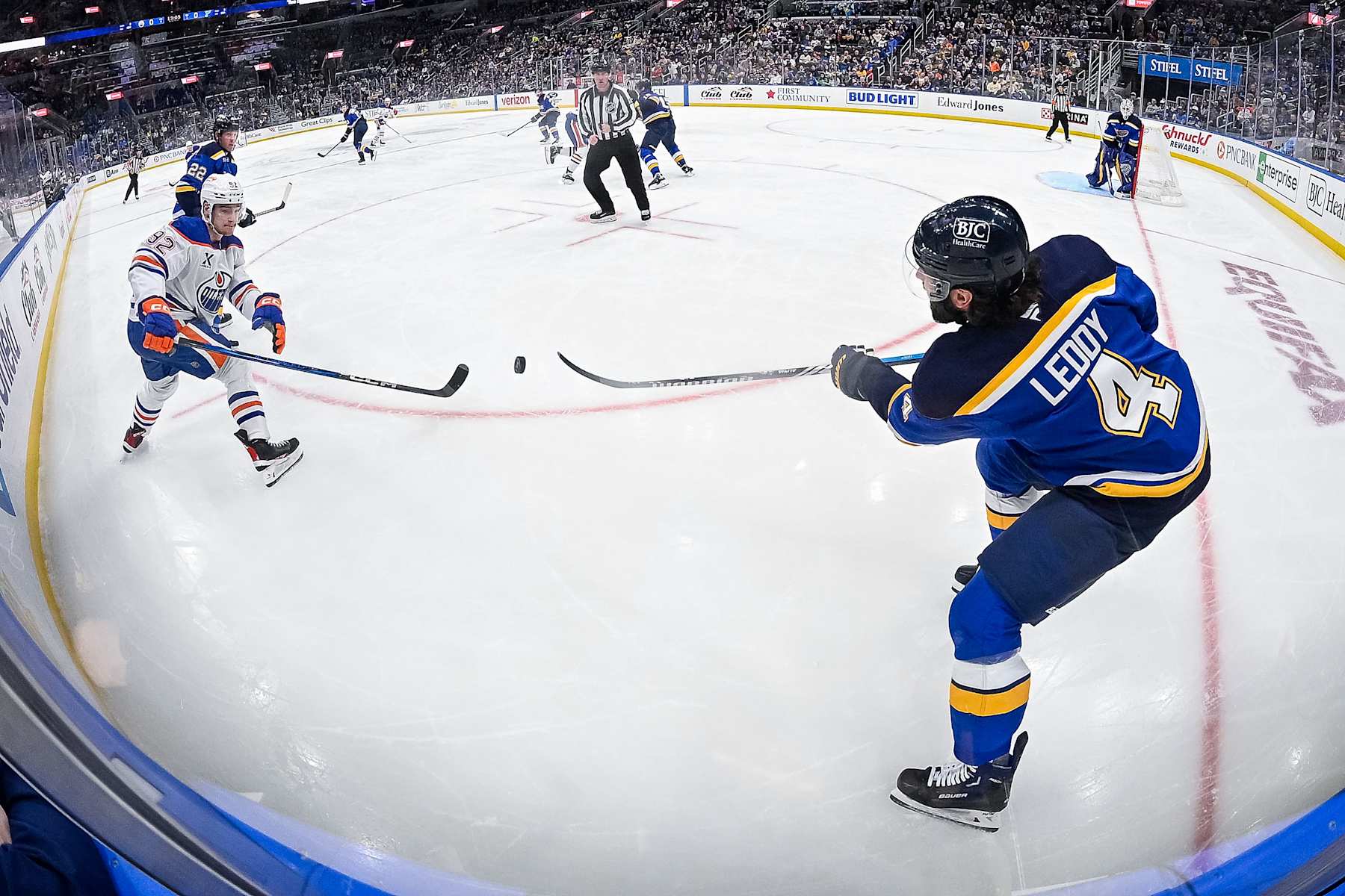 ST. LOUIS, MO - FEBRUARY 4: Nick Leddy #4 of the St. Louis Blues passes the puck as Vasily Podkolzin #92 of the Edmonton Oilers pressures on February 4, 2025 at the Enterprise Center in St. Louis, Missouri. (Photo by Scott Rovak/NHLI via Getty Images)