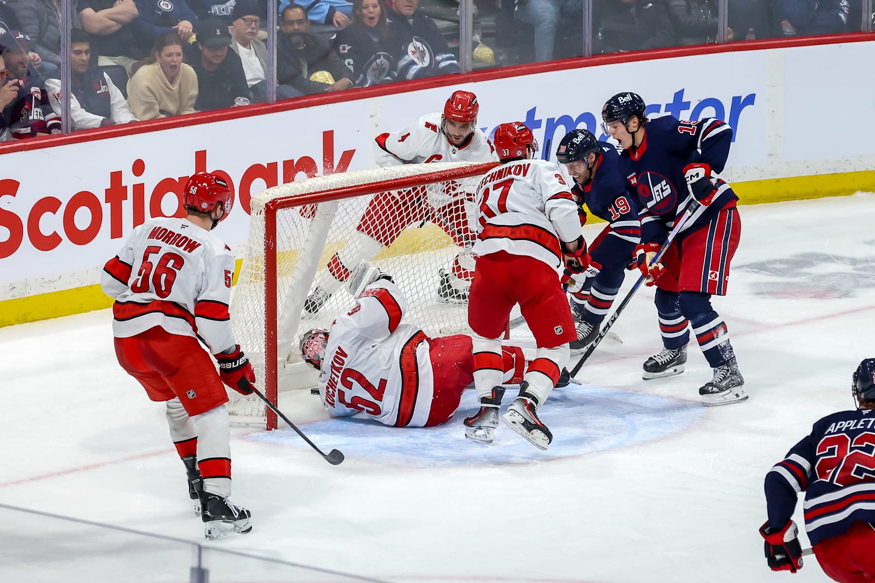WINNIPEG, CANADA - FEBRUARY 4: David Gustafsson #19 and Rasmus Kupari #15 of the Winnipeg Jets react as the puck gets past goaltender Pyotr Kochetkov #52 of the Carolina Hurricanes for a third period goal at the Canada Life Centre on February 4, 2025 in Winnipeg, Manitoba, Canada. (Photo by Jonathan Kozub/NHLI via Getty Images)