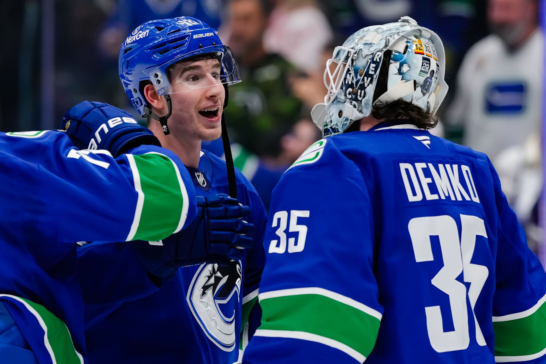VANCOUVER, CANADA - FEBRUARY 4: Drew O'Connor #18 and Thatcher Demko #35 of the Vancouver Canucks celebrate after defeating the Colorado Avalanche at Rogers Arena on February 4, 2025 in Vancouver, British Columbia, Canada. (Photo by Derek Cain/Getty Images)