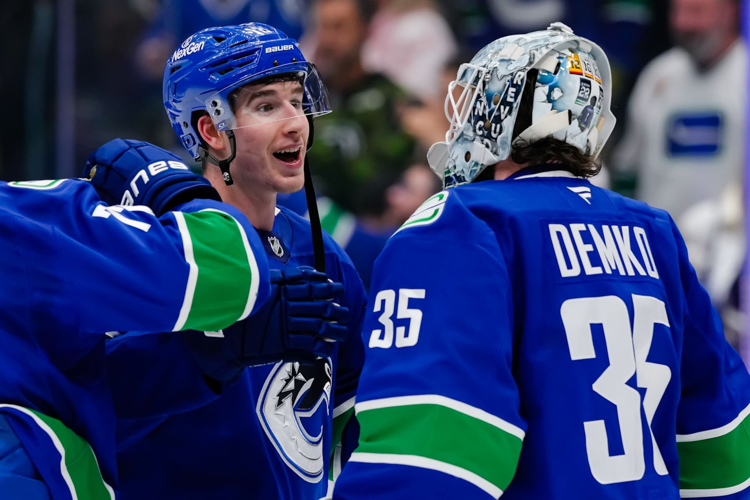 VANCOUVER, CANADA - FEBRUARY 4: Drew O'Connor #18 and Thatcher Demko #35 of the Vancouver Canucks celebrate after defeating the Colorado Avalanche at Rogers Arena on February 4, 2025 in Vancouver, British Columbia, Canada. (Photo by Derek Cain/Getty Images)