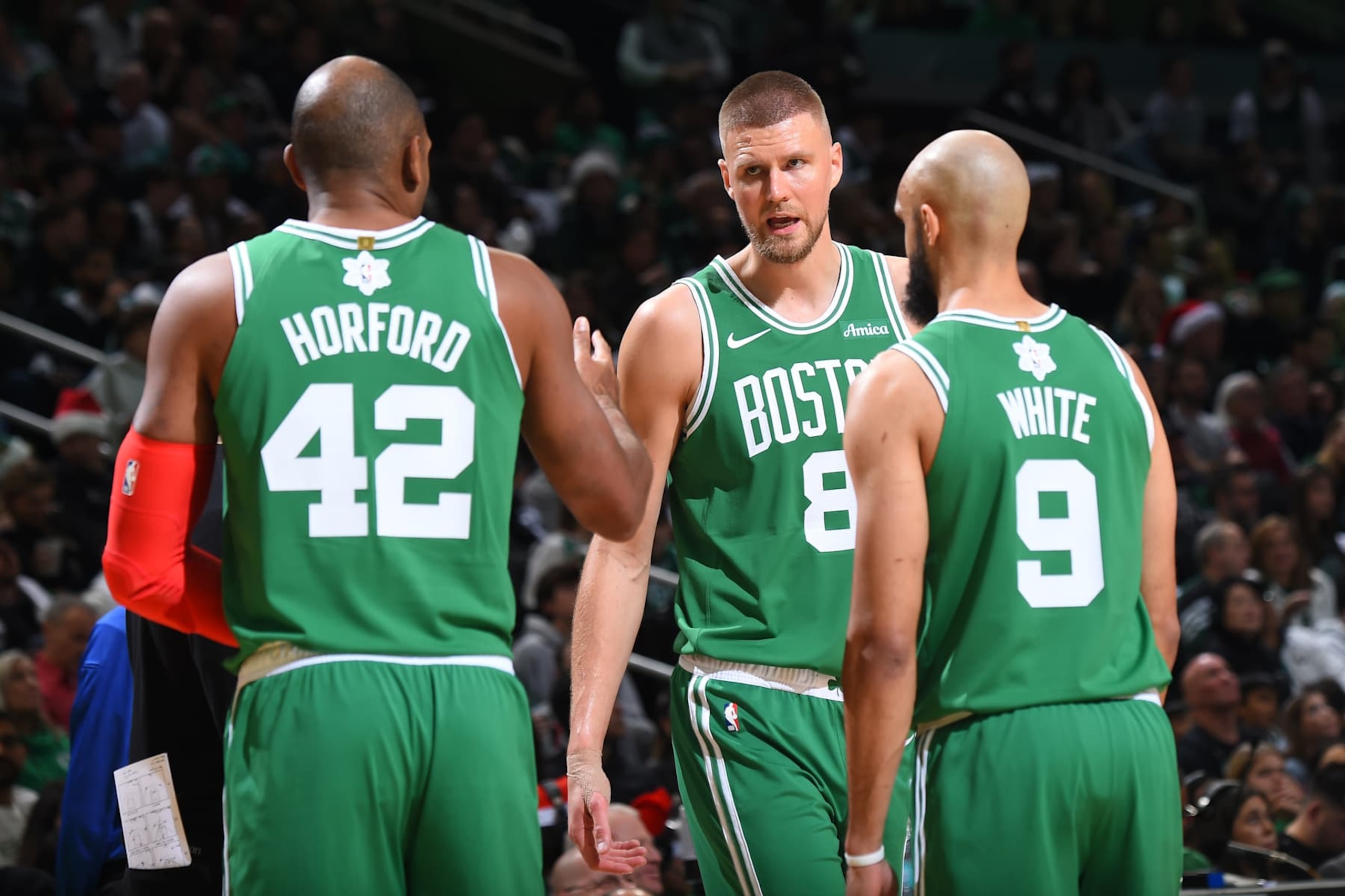 BOSTON, MA - DECEMBER 25: Kristaps Porzingis #8 of the Boston Celtics talks to Al Horford #42 during the game against the Philadelphia 76ers on December 25, 2024 at the TD Garden in Boston, Massachusetts. NOTE TO USER: User expressly acknowledges and agrees that, by downloading and or using this photograph, User is consenting to the terms and conditions of the Getty Images License Agreement. Mandatory Copyright Notice: Copyright 2024 NBAE(Photo by Brian Babineau/NBAE via Getty Images) BOSTON, MA - DECEMBER 25: Kristaps Porzingis #8 of the Boston Celtics talks to Al Horford #42 during the game against the Philadelphia 76ers on December 25, 2024 at the TD Garden in Boston, Massachusetts. NOTE TO USER: User expressly acknowledges and agrees that, by downloading and or using this photograph, User is consenting to the terms and conditions of the Getty Images License Agreement. Mandatory Copyright Notice: Copyright 2024 NBAE(Photo by Brian Babineau/NBAE via Getty Images)
