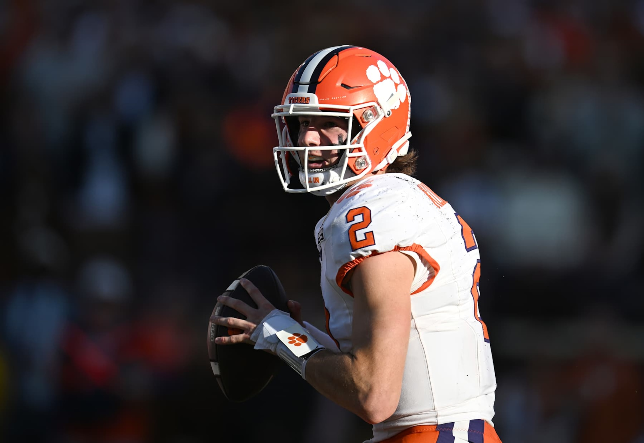 AUSTIN, TEXAS - DECEMBER 21: Cade Klubnik #2 of the Clemson Tigers looks to throw the ball during the first quarter against the Texas Longhorns in the Playoff First Round Game at Darrell K Royal-Texas Memorial Stadium on December 21, 2024 in Austin, Texas. (Photo by Jack Gorman/Getty Images) AUSTIN, TEXAS - DECEMBER 21: Cade Klubnik #2 of the Clemson Tigers looks to throw the ball during the first quarter against the Texas Longhorns in the Playoff First Round Game at Darrell K Royal-Texas Memorial Stadium on December 21, 2024 in Austin, Texas. (Photo by Jack Gorman/Getty Images)