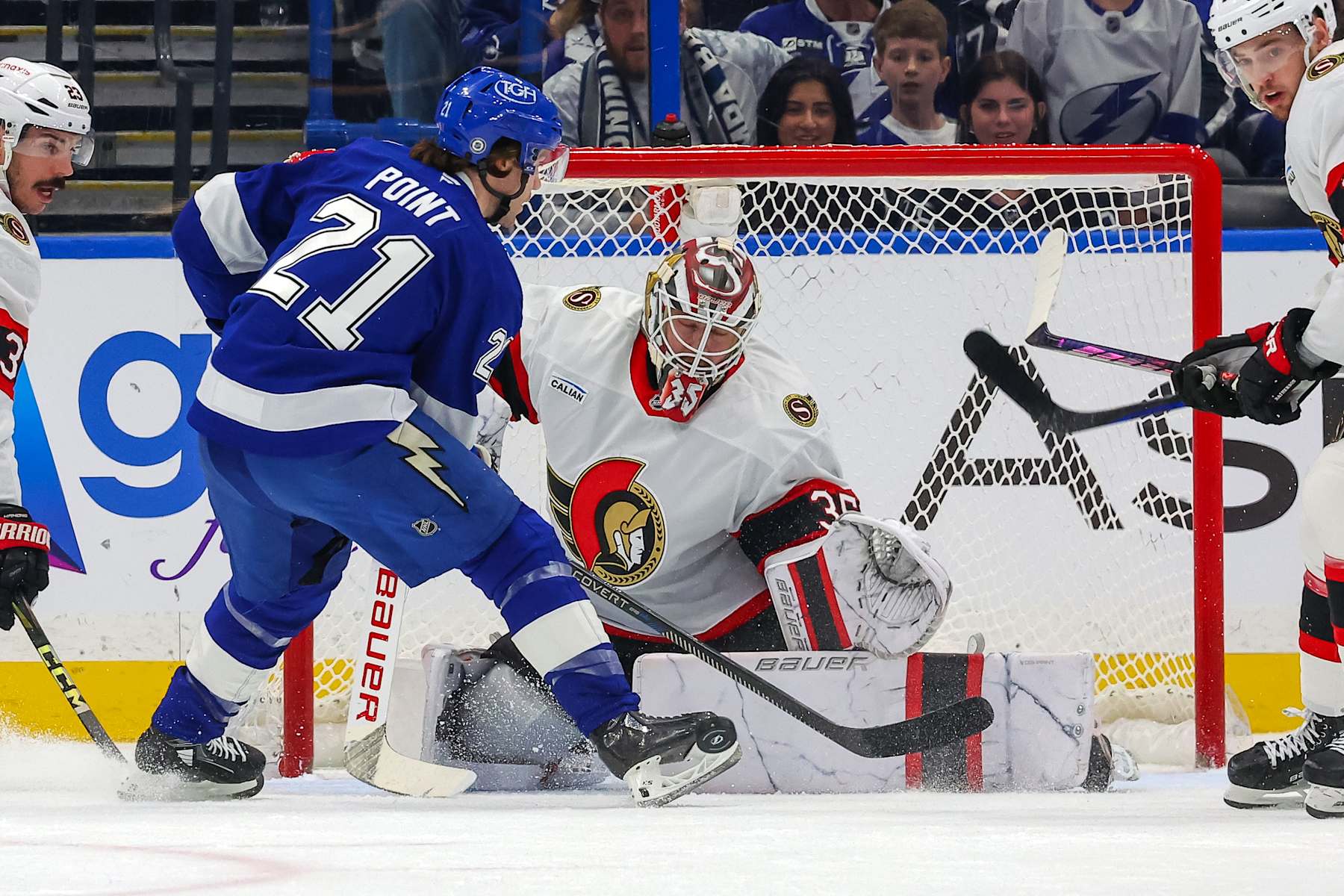 TAMPA, FL - FEBRUARY 4: Linus Ullmark #35 of the Ottawa Senators makes a save against Brayden Point #21 of the Tampa Bay Lightning during the first period at the Amalie Arena on February 4, 2025 in Tampa, Florida. (Photo by Mike Carlson/Getty Images)