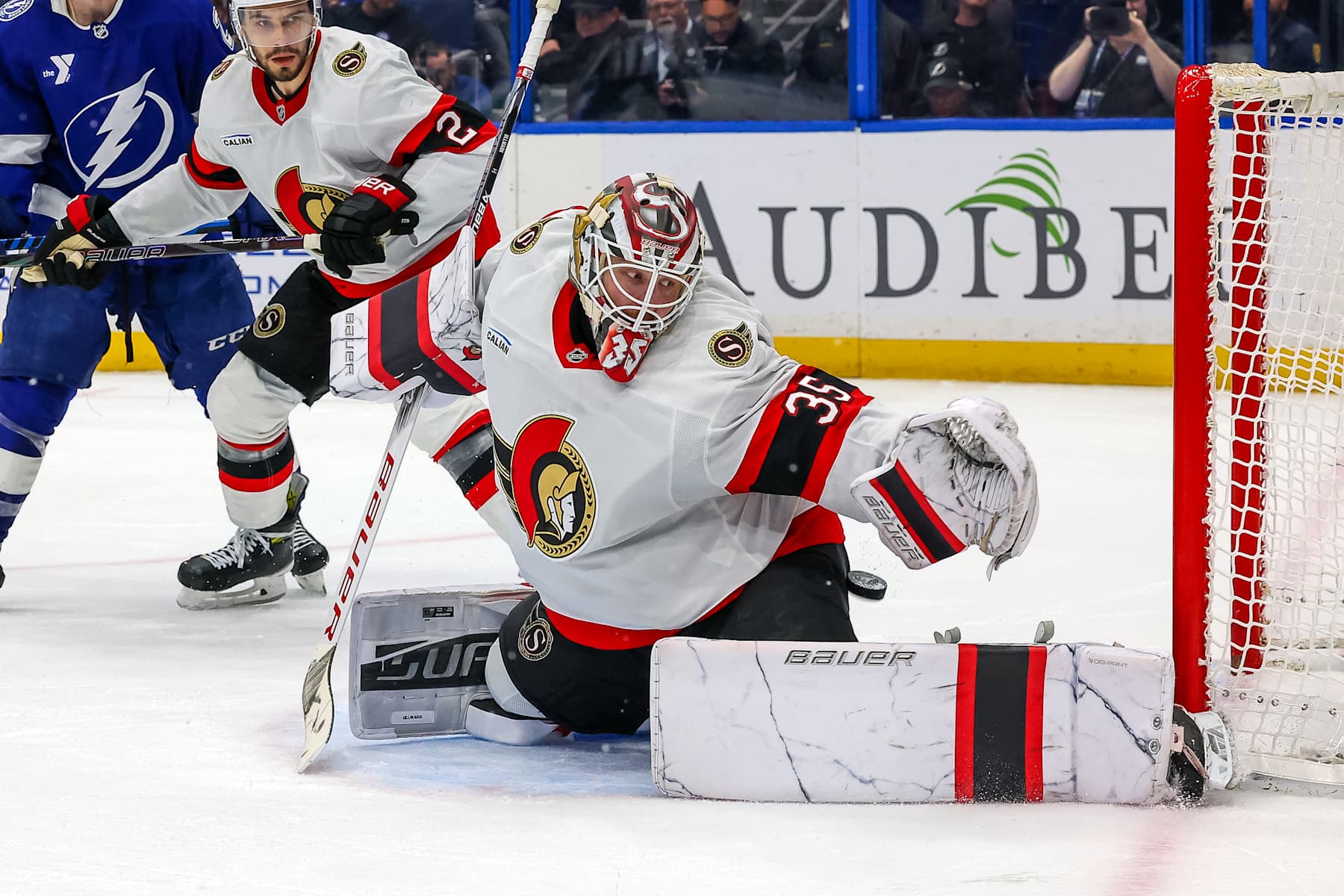 TAMPA, FL - FEBRUARY 4: Linus Ullmark #35 of the Ottawa Senators makes a save against the Tampa Bay Lightning during the second period at the Amalie Arena on February 4, 2025 in Tampa, Florida. (Photo by Mike Carlson/Getty Images)