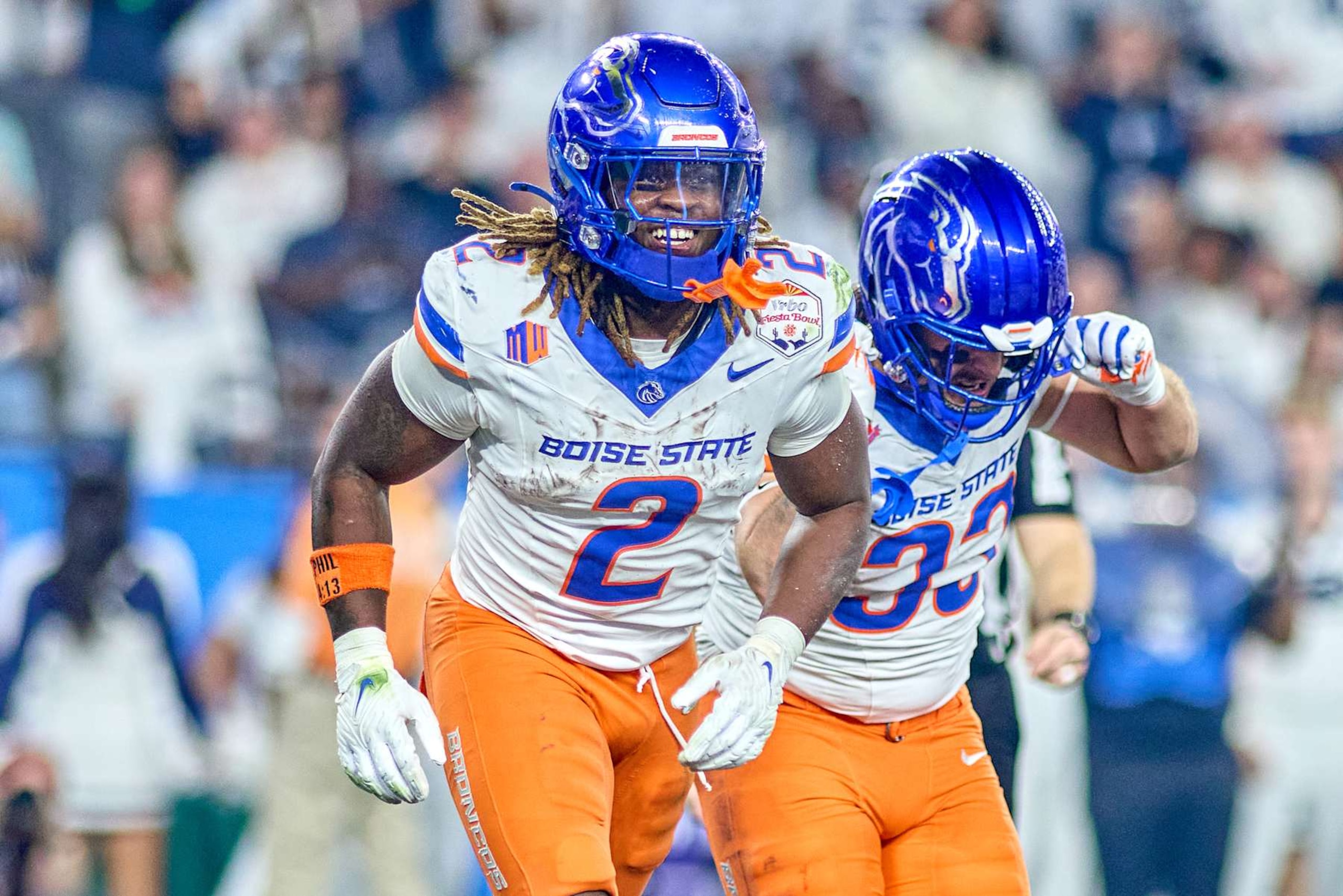 GLENDALE, ARIZONA - DECEMBER 31: Boise State Broncos wide receiver Latrell Caples (3) celebrates with running back Ashton Jeanty (2) after scoring a touchdown  in action during the 2024 Vrbo Fiesta Bowl between the Penn State Nittany Lions and Boise State Broncos at State Farm Stadium on December 31, 2024 in Glendale, Arizona. (Photo by Robin Alam/ISI Photos/Getty Images)
