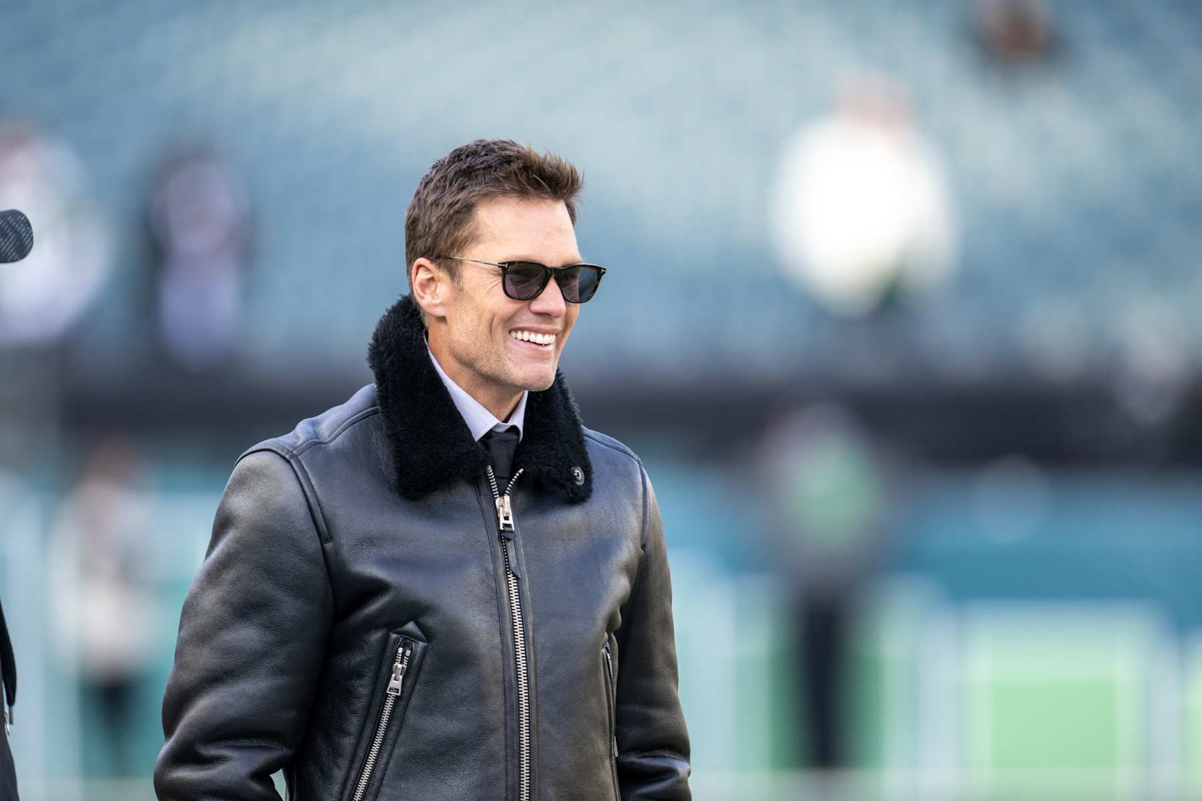 PHILADELPHIA, PA - JANUARY 12: NFL legend and Fox commentator Tom Brady smiles before the NFC Wild Card playoff game between the Green Bay Packers and the Philadelphia Eagles on January 12th, 2025 at Lincoln Financial Field in Philadelphia, PA. (Photo by Terence Lewis/Icon Sportswire via Getty Images)
