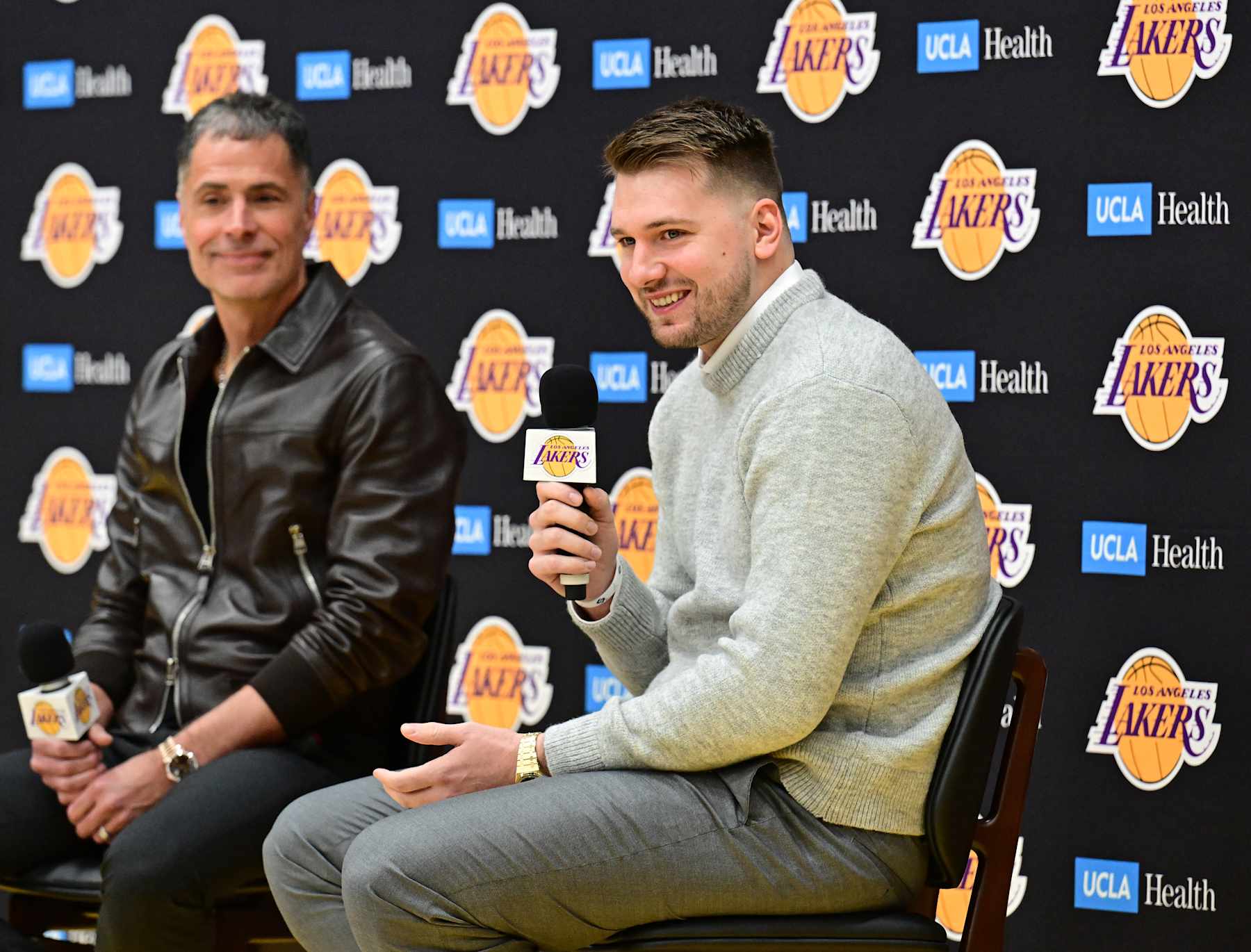 EL SEGUNDO, CA - FEBRUARY 04: Luka Doncic #77 of the Los Angeles Lakers is introduced by Rob Pelinka during a press conference on February 04, 2025 at UCLA Health Training Center in El Segundo, California. NOTE TO USER: User expressly acknowledges and agrees that, by downloading and or using this photograph, User is consenting to the terms and conditions of the Getty Images License Agreement. Mandatory Copyright Notice: Copyright 2025 NBAE (Photo by Adam Pantozzi/NBAE via Getty Images)