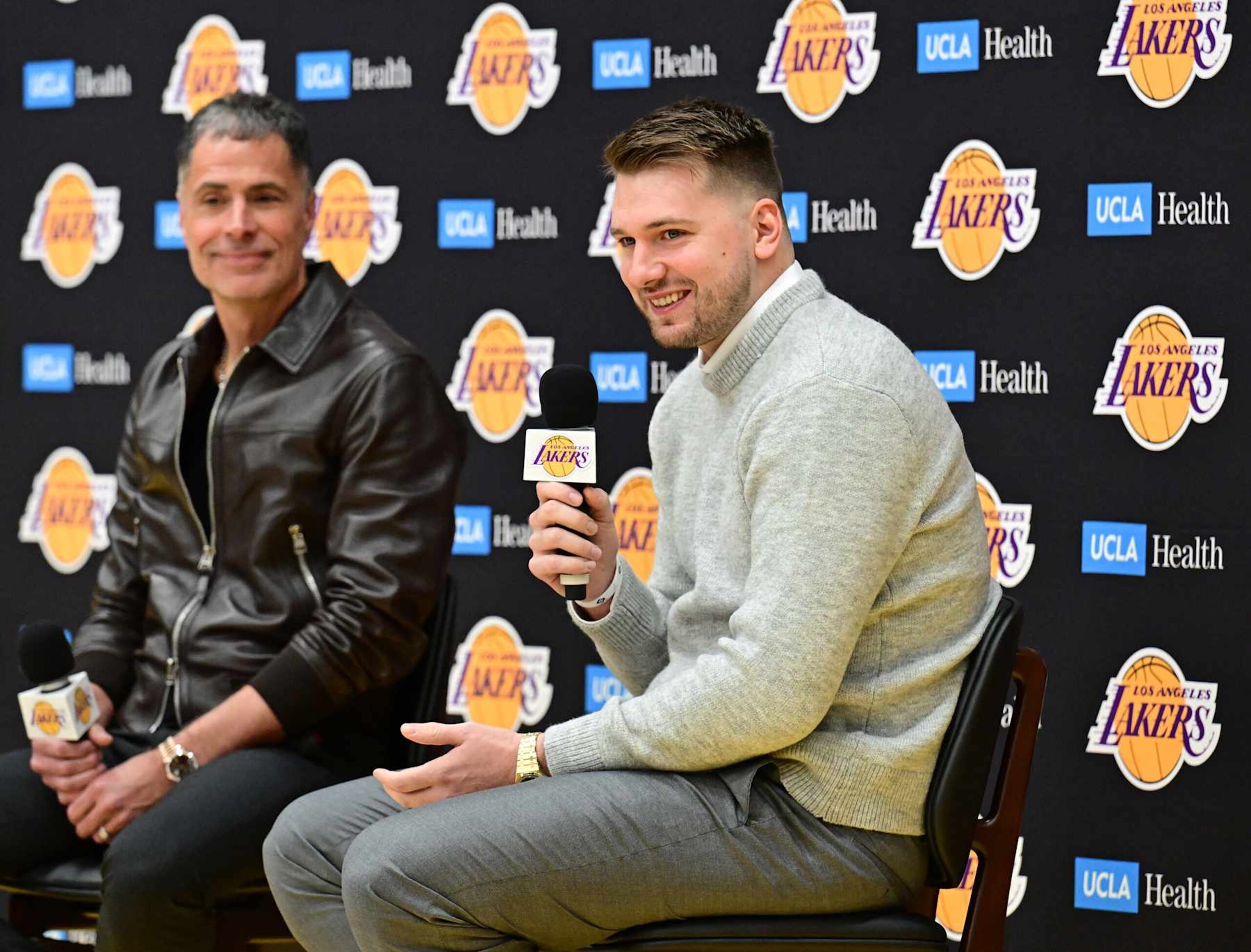 EL SEGUNDO, CA - FEBRUARY 04: Luka Doncic #77 of the Los Angeles Lakers is introduced by Rob Pelinka during a press conference on February 04, 2025 at UCLA Health Training Center in El Segundo, California. NOTE TO USER: User expressly acknowledges and agrees that, by downloading and or using this photograph, User is consenting to the terms and conditions of the Getty Images License Agreement. Mandatory Copyright Notice: Copyright 2025 NBAE (Photo by Adam Pantozzi/NBAE via Getty Images)