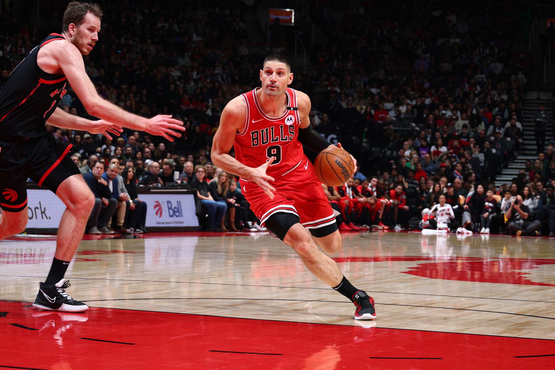 TORONTO, CANADA - JANUARY 31:  Nikola Vucevic #9 of the Chicago Bulls dribbles the ball during the game against the Toronto Raptors on January 31, 2025 at the Scotiabank Arena in Toronto, Ontario, Canada.  NOTE TO USER: User expressly acknowledges and agrees that, by downloading and or using this Photograph, user is consenting to the terms and conditions of the Getty Images License Agreement.  Mandatory Copyright Notice: Copyright 2025 NBAE (Photo by Vaughn Ridley/NBAE via Getty Images)