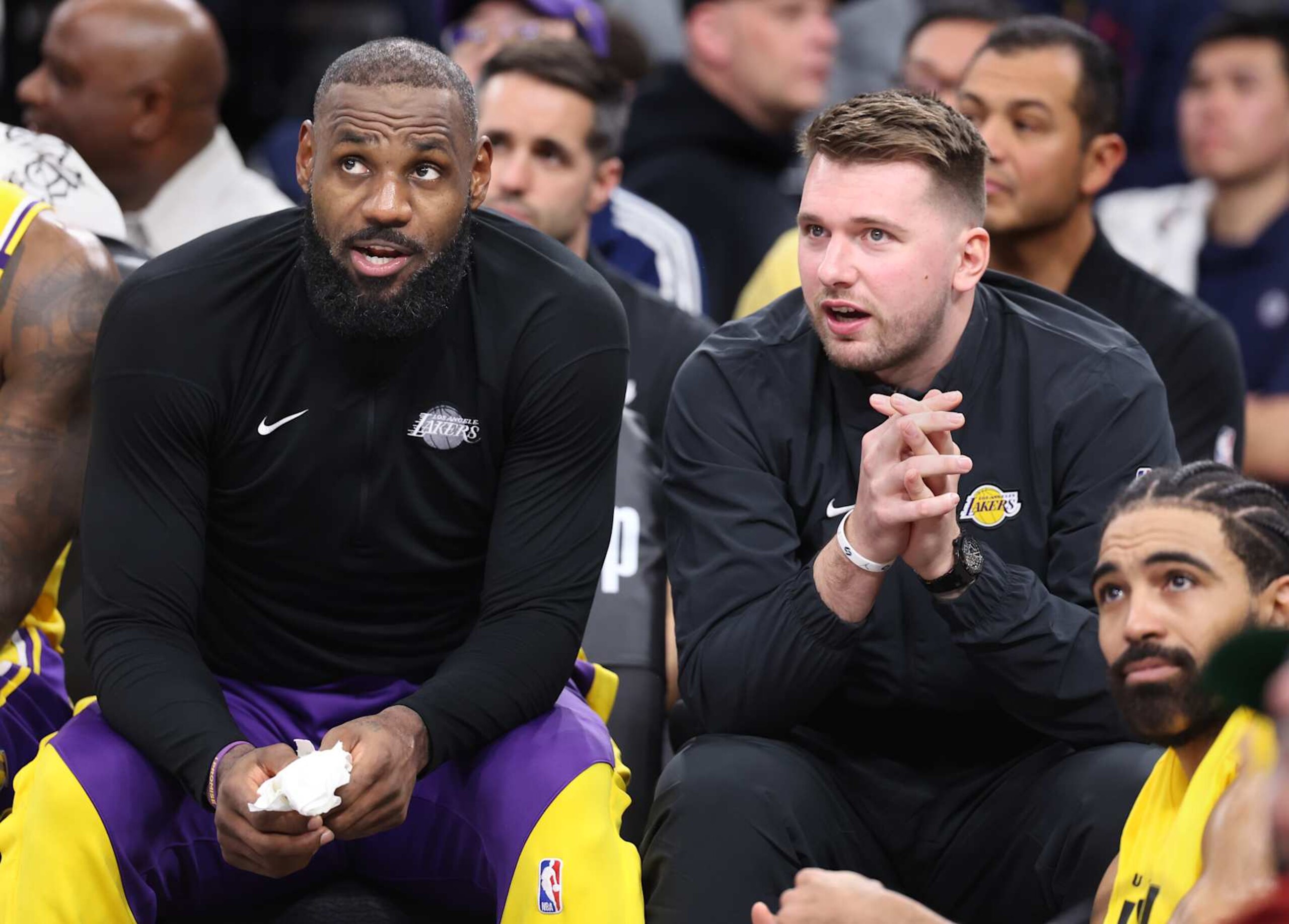 Inglewood, California February 4, 2025-Lakers LeBron James, left, and Luka Doncic sit next to the bench against the Clippers in the second half at the Intuit Dome Tuesday. (Wally Skalij/Los Angeles Times via Getty Images)