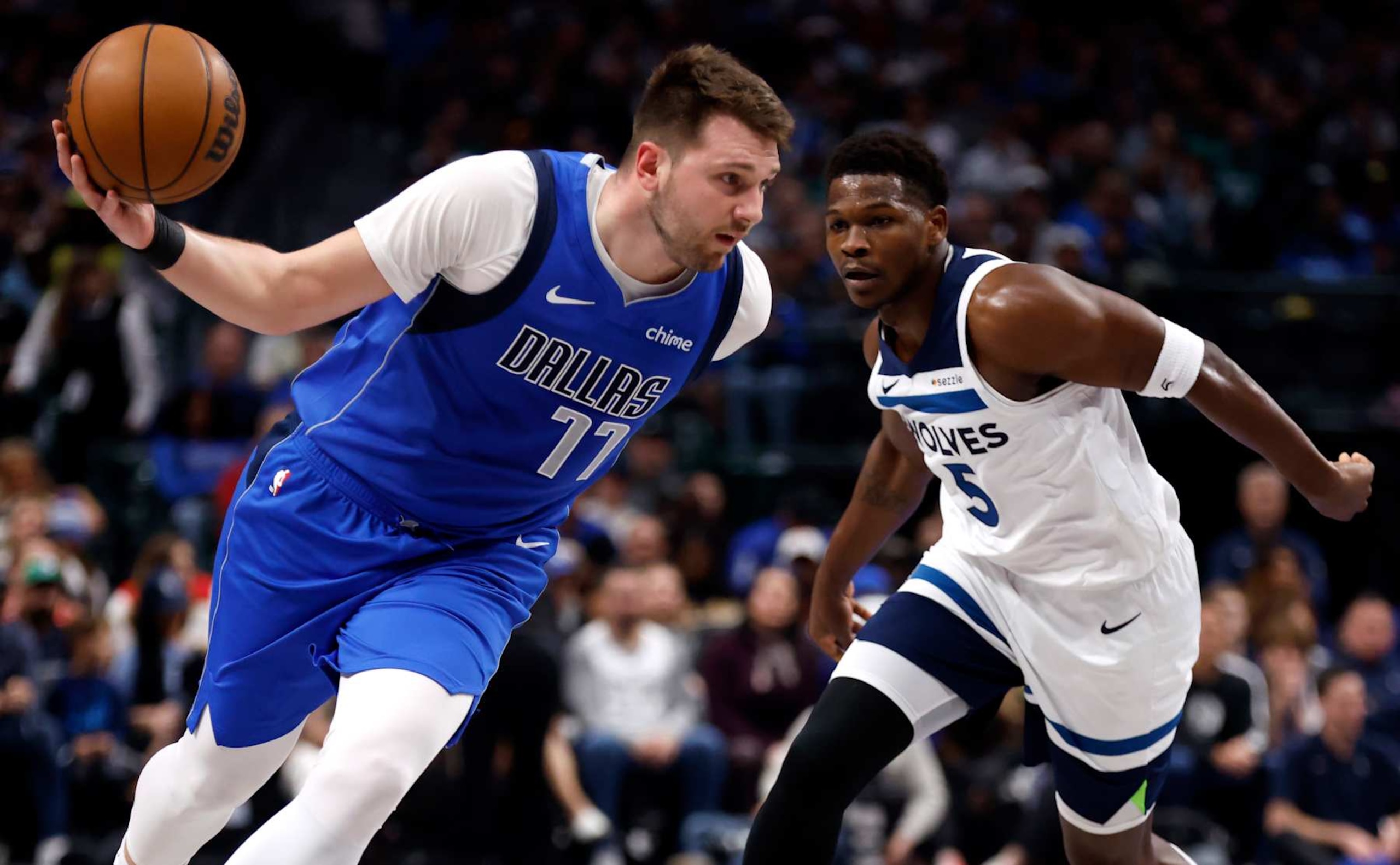 DALLAS, TX -DECEMBER 25 : Luka Doncic #77 of the Dallas Mavericks drives inside as Anthony Edwards #5 of the Minnesota Timberwolves defends in the first half at American Airlines Center on December 25, 2024 in Dallas, Texas. NOTE TO USER: User expressly acknowledges and agrees that, by downloading and or using this photograph, User is consenting to the terms and conditions of the Getty Images License Agreement. (Photo by Ron Jenkins/Getty Images)