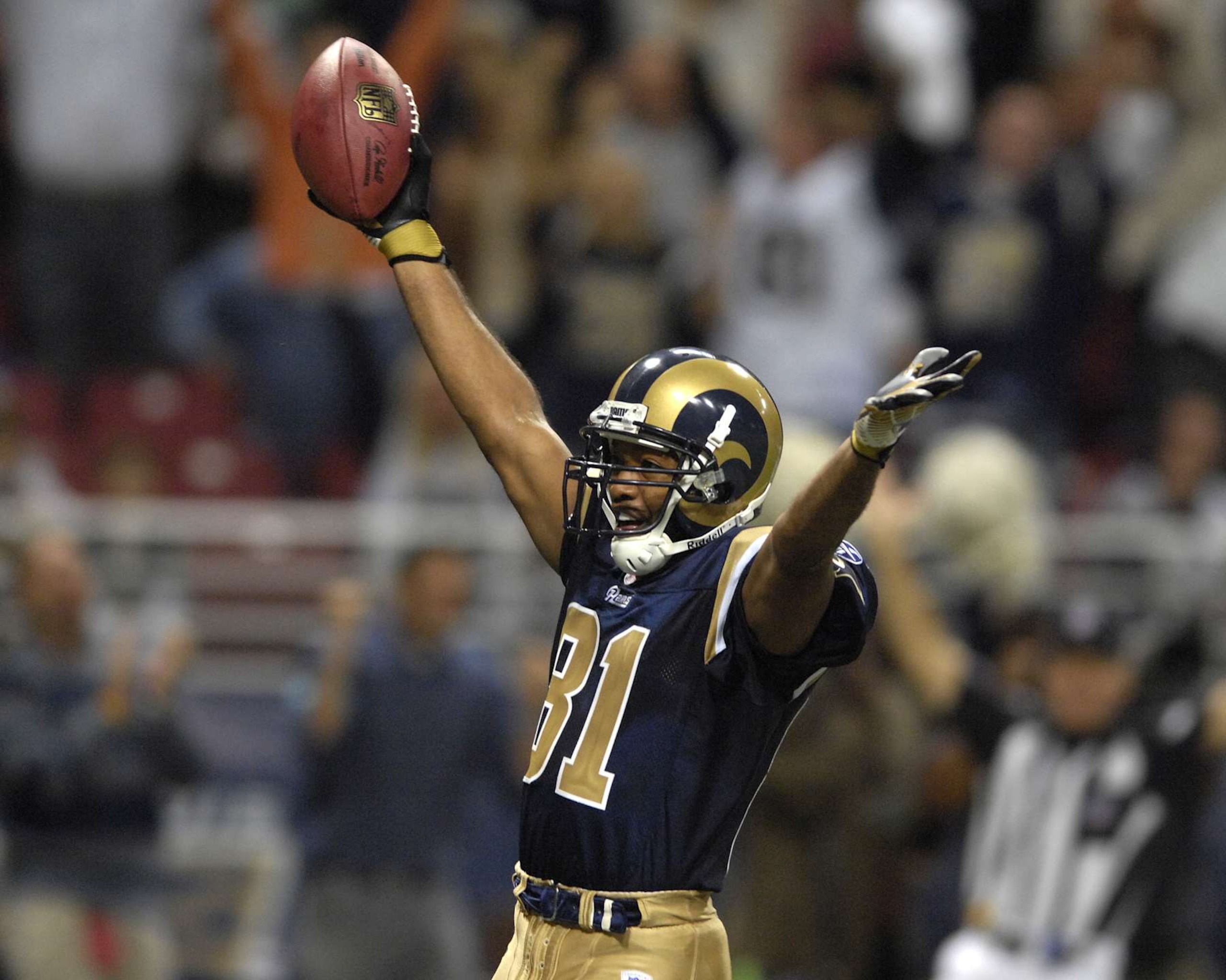 St. Louis Rams wide receiver Torry Holt (81) celebrates after scoring a late fourth quarter touchdown, giving the Rams a 28-27 lead over Seattle at the Edward Jones Dome in St. Louis, Missouri, October 15, 2006.  The Seahawks beat the Rams 30-27. (Photo by Peter Aiken/Getty Images)