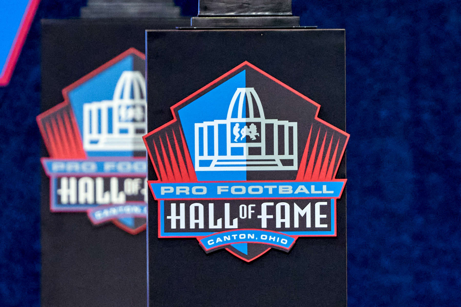 CANTON, OH - AUGUST 07: A detal view of the Hall of Fame logo is seen on a bust stand during the Pro Football HOF Centennial Class of 2020 enshrinement ceremonies on August 7, 2021 at Tom Benson Hall of Fame Stadium, in Canton, OH. (Photo by MSA/Icon Sportswire via Getty Images)