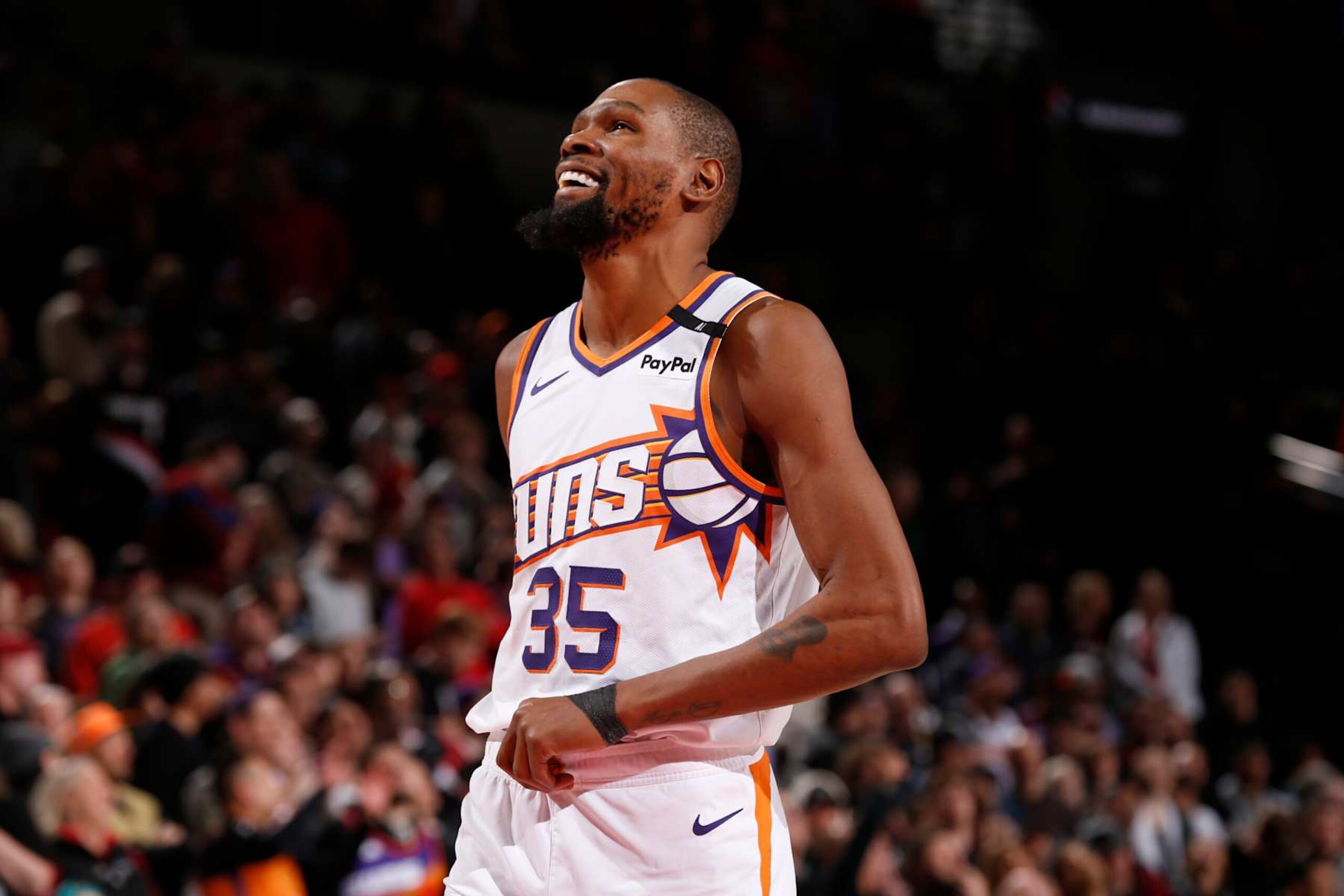 PORTLAND, OR - FEBRUARY 3: Kevin Durant #35 of the Phoenix Suns smiles during the game against the Portland Trail Blazers on February 3, 2025 at the Moda Center Arena in Portland, Oregon. NOTE TO USER: User expressly acknowledges and agrees that, by downloading and or using this photograph, user is consenting to the terms and conditions of the Getty Images License Agreement. Mandatory Copyright Notice: Copyright 2025 NBAE (Photo by Cameron Browne/NBAE via Getty Images) PORTLAND, OR - FEBRUARY 3: Kevin Durant #35 of the Phoenix Suns smiles during the game against the Portland Trail Blazers on February 3, 2025 at the Moda Center Arena in Portland, Oregon. NOTE TO USER: User expressly acknowledges and agrees that, by downloading and or using this photograph, user is consenting to the terms and conditions of the Getty Images License Agreement. Mandatory Copyright Notice: Copyright 2025 NBAE (Photo by Cameron Browne/NBAE via Getty Images)