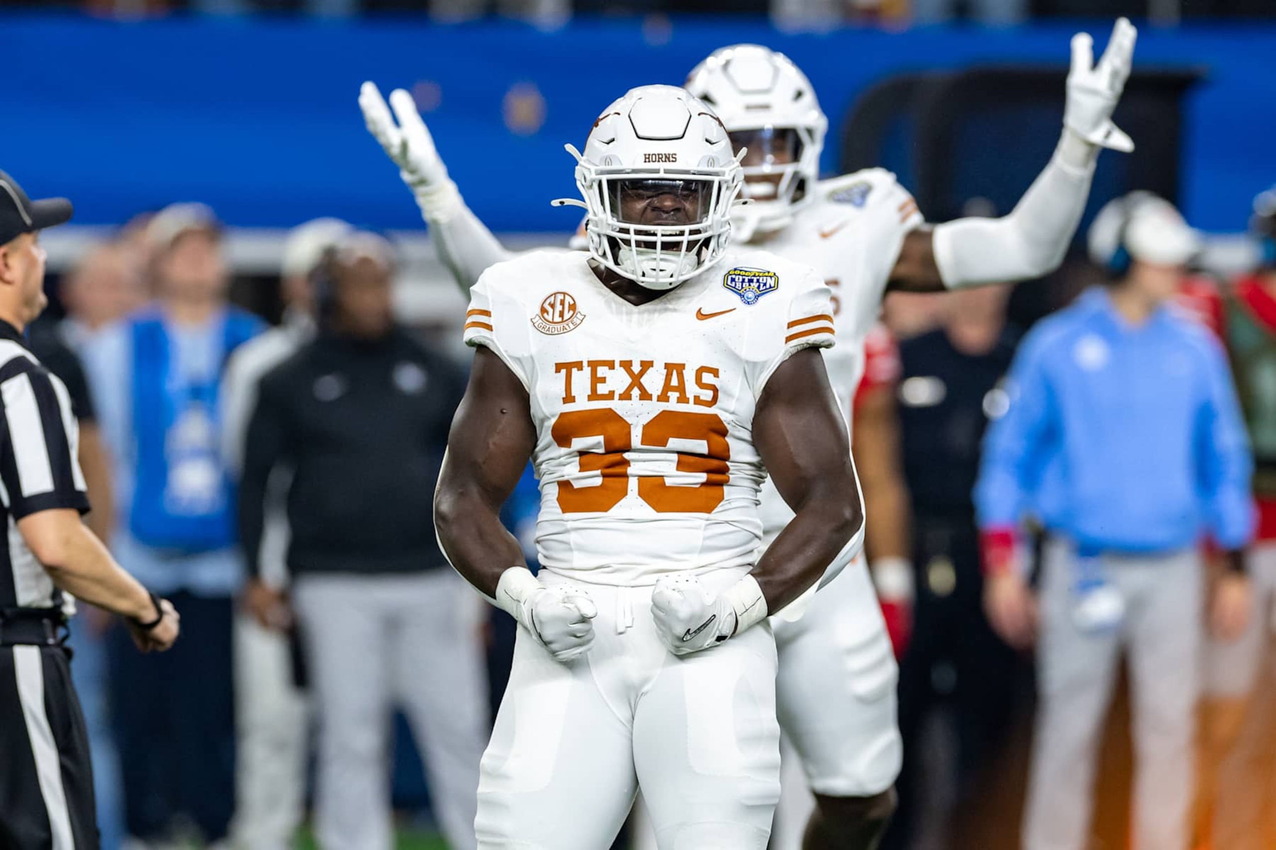 ARLINGTON, TX - JANUARY 10: Texas Longhorns linebacker David Gbenda (#33) celebrates after a defensive stop during the CFP Semifinal Cotton Bowl Classic football game between the Ohio State Buckeyes and Texas Longhorns on January 10, 2025 at AT&T Stadium in Arlington, TX.  (Photo by Matthew Visinsky/Icon Sportswire via Getty Images)