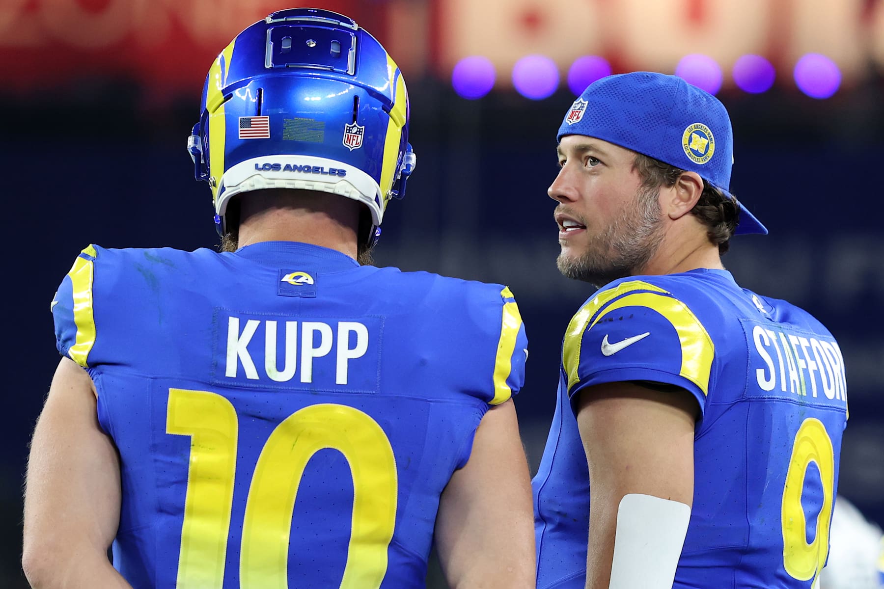 GLENDALE, ARIZONA - JANUARY 13: Matthew Stafford #9 of the Los Angeles Rams speaks with Cooper Kupp #10 during the fourth quarter against the Minnesota Vikings during the NFC Wild Card Playoff at State Farm Stadium on January 13, 2025 in Glendale, Arizona.  (Photo by Christian Petersen/Getty Images)
