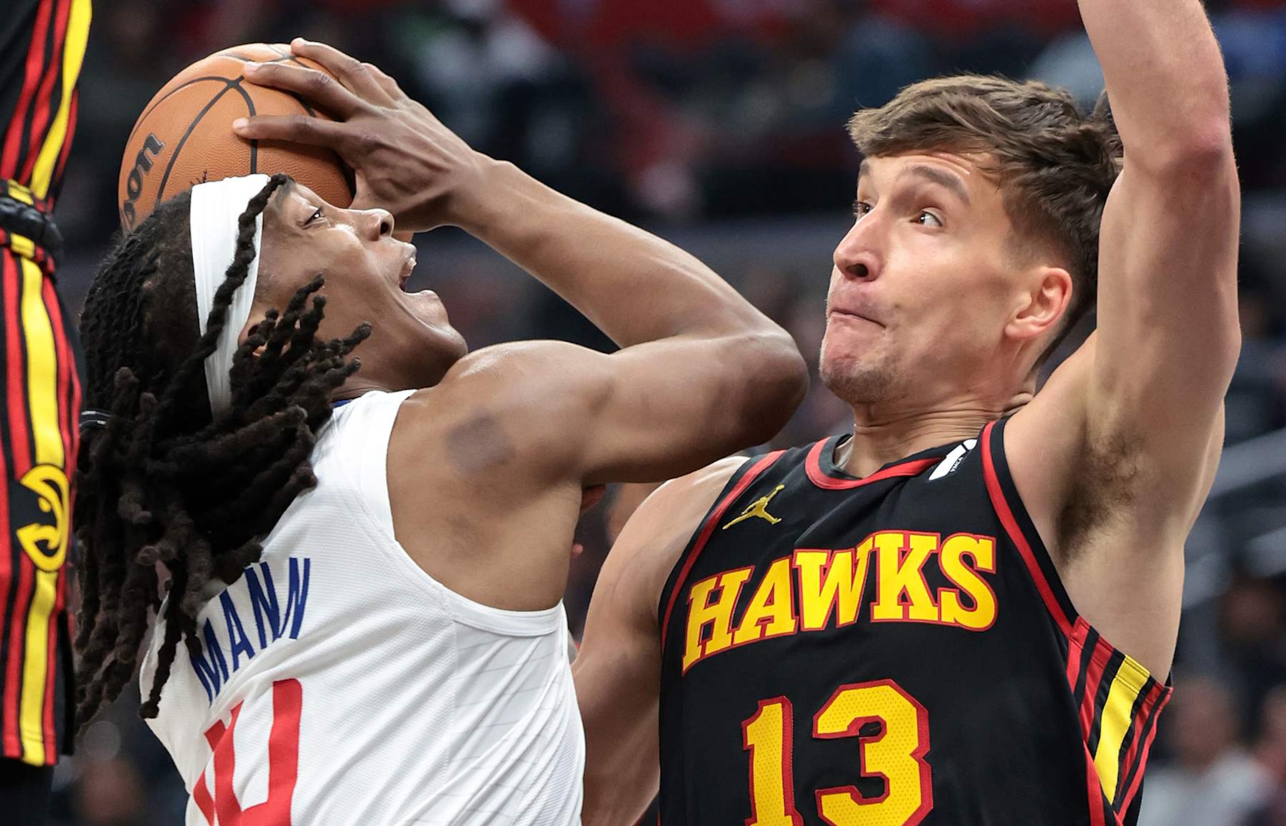 Los Angeles, California March 17, 2024-Clippers Terance Mann drives to the basket against Hawks Bogdan Bogdanovic in the second half at Crypto.com Arena Sunday. (Wally Skalij/Los Angeles Times via Getty Images)