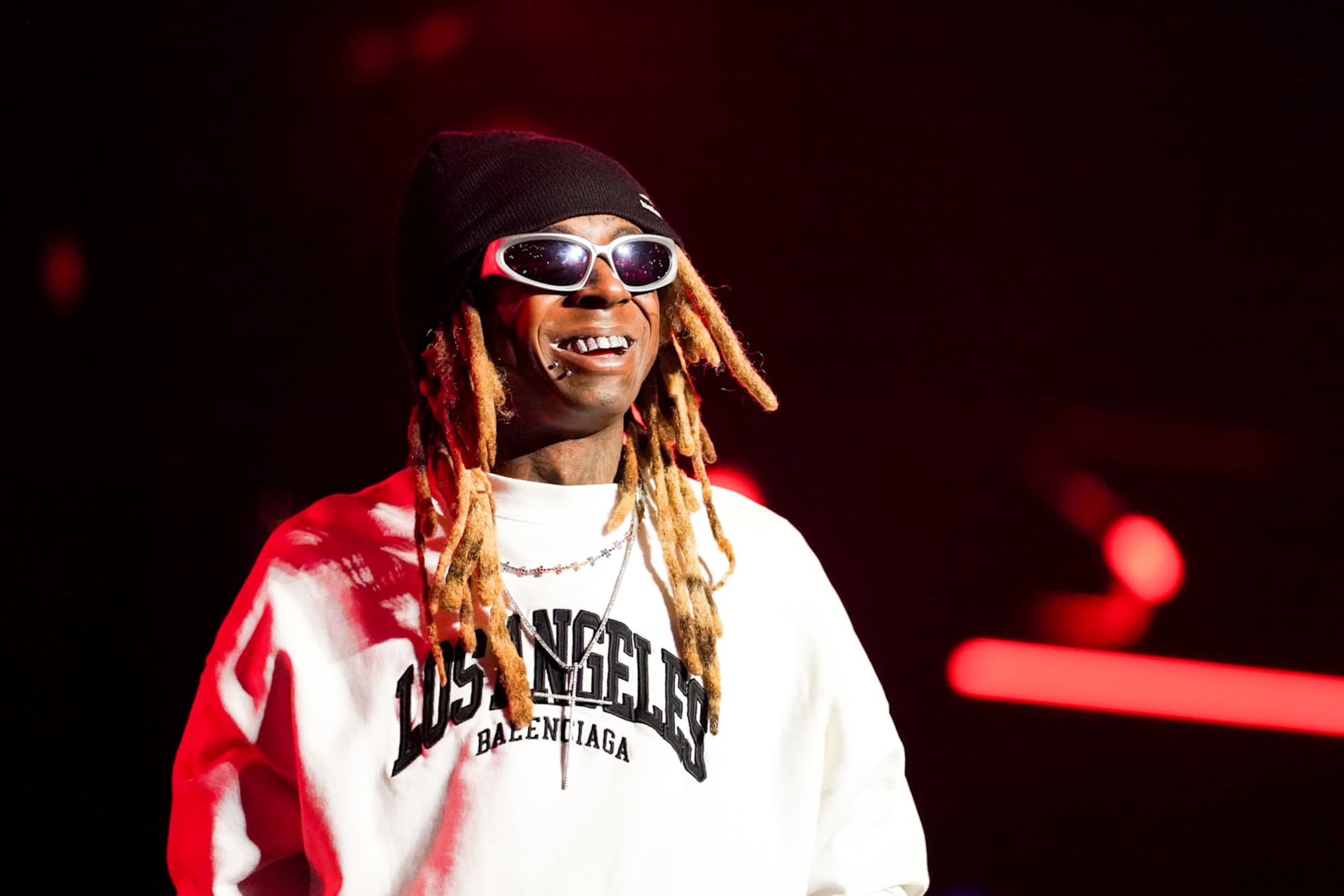 ATLANTA, GEORGIA - JANUARY 18: Lil Wayne performs onstage during the AT&T Playoff Playlist Live! concert at State Farm Arena on January 18, 2025 in Atlanta, Georgia. (Photo by Julia Beverly/Getty Images) ATLANTA, GEORGIA - JANUARY 18: Lil Wayne performs onstage during the AT&T Playoff Playlist Live! concert at State Farm Arena on January 18, 2025 in Atlanta, Georgia. (Photo by Julia Beverly/Getty Images)