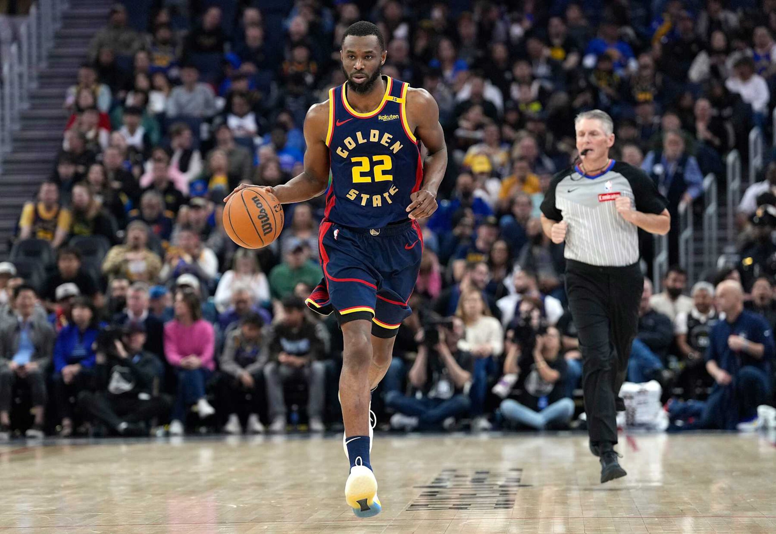 SAN FRANCISCO, CALIFORNIA - JANUARY 31: Andrew Wiggins #22 of the Golden State Warriors dribbles the ball up court against the Phoenix Suns during the first half of an NBA basketball game at Chase Center on January 31, 2025 in San Francisco, California. NOTE TO USER: User expressly acknowledges and agrees that, by downloading and or using this photograph, User is consenting to the terms and conditions of the Getty Images License Agreement. (Photo by Thearon W. Henderson/Getty Images)