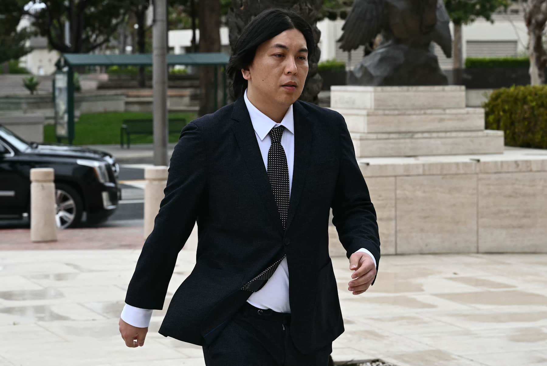 Ippei Mizuhara arrives for his sentencing at the Ronald Reagan Federal Building and Courthouse in Santa Ana, California, on February 6, 2025. Shohei Ohtani's former interpreter, Mizuhara, is scheduled to be sentenced February 6 after pleading guilty over charges of illegally transferring nearly $17 million from the baseball star's bank account in order to pay off gambling debts. (Photo by Patrick T. Fallon / AFP) (Photo by PATRICK T. FALLON/AFP via Getty Images)          